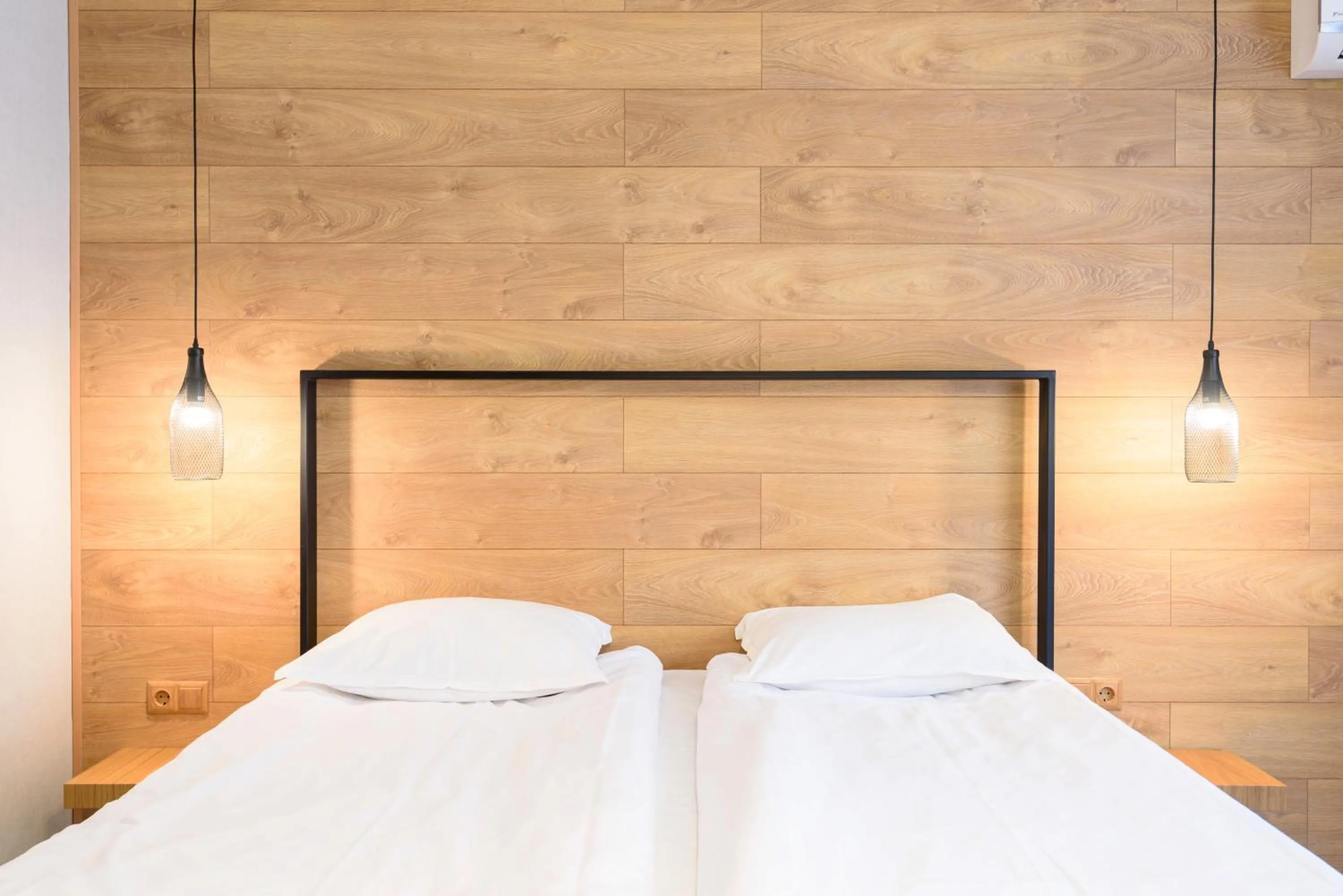 Bed in Avenue Hotel Deluxe