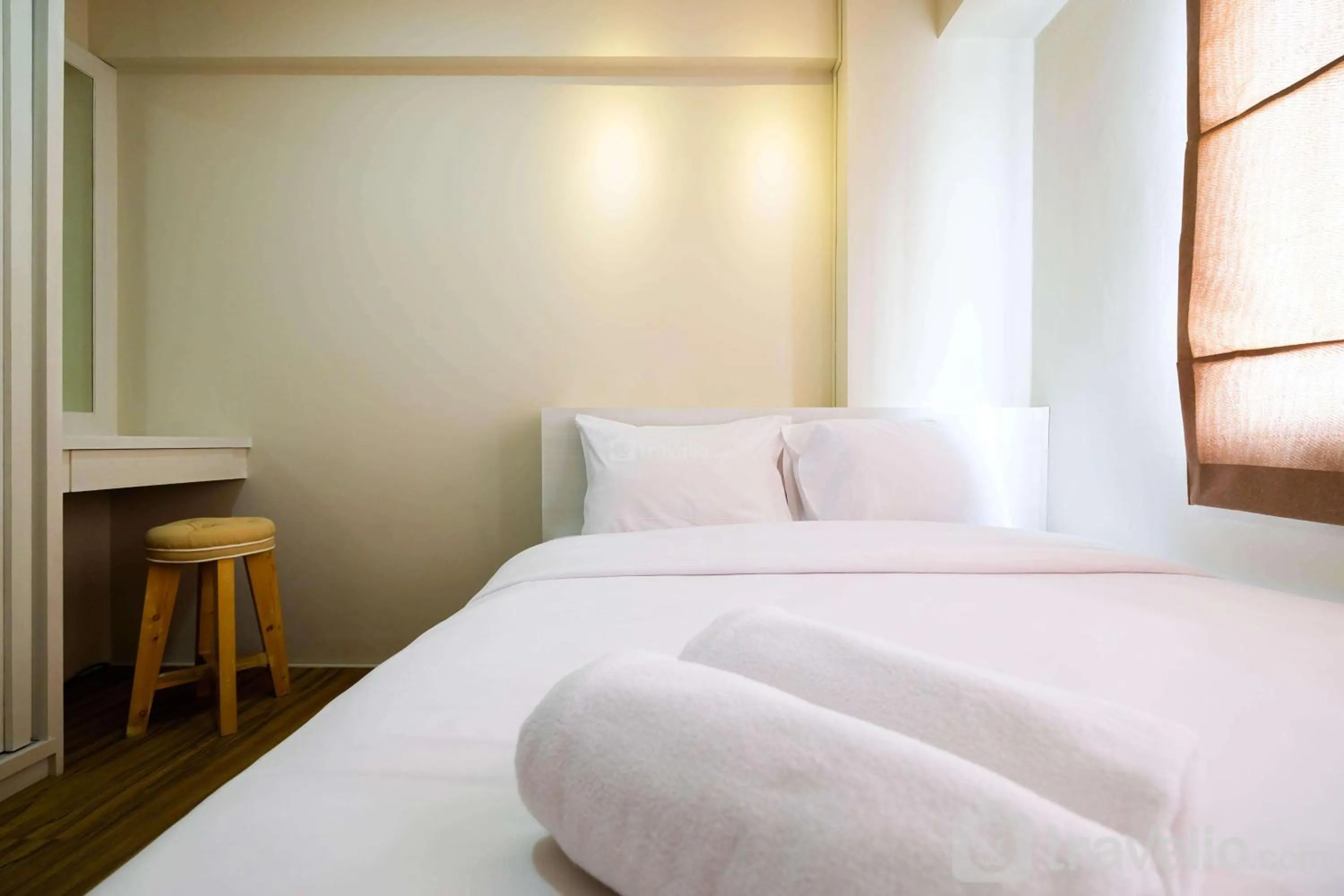 Connect to Pool 2BR Apartment at Bassura City By Travelio