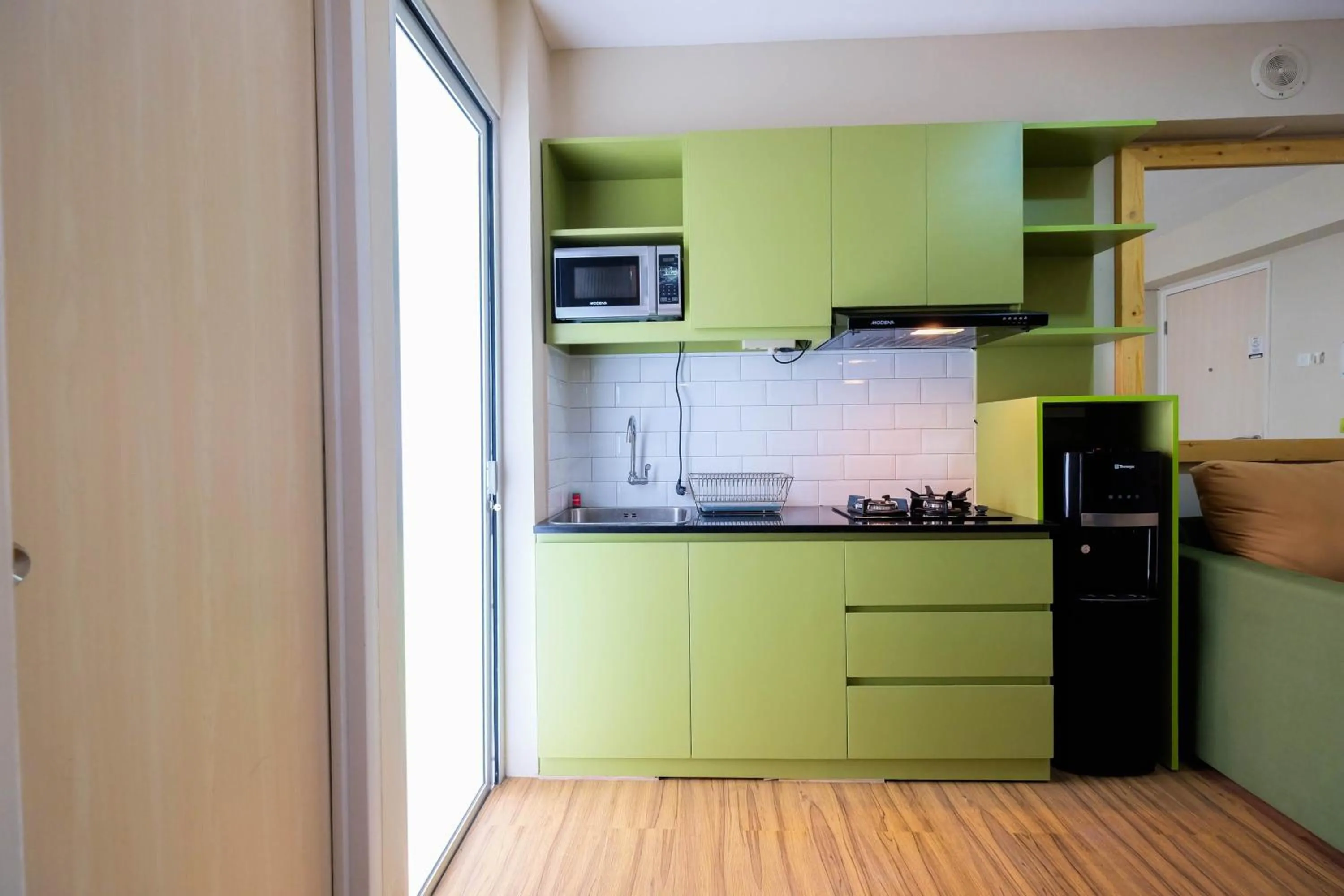 Connect to Pool 2BR Apartment at Bassura City By Travelio