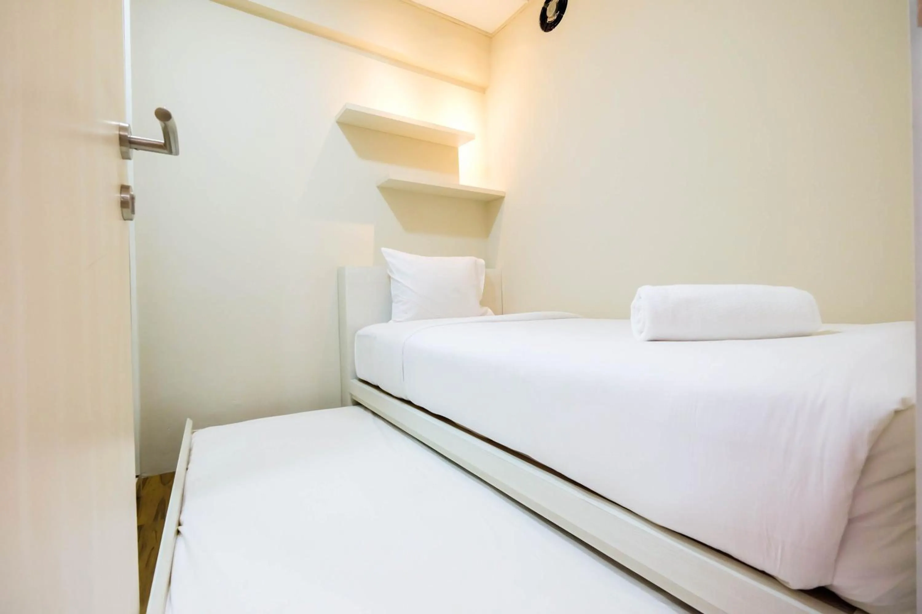 Connect to Pool 2BR Apartment at Bassura City By Travelio