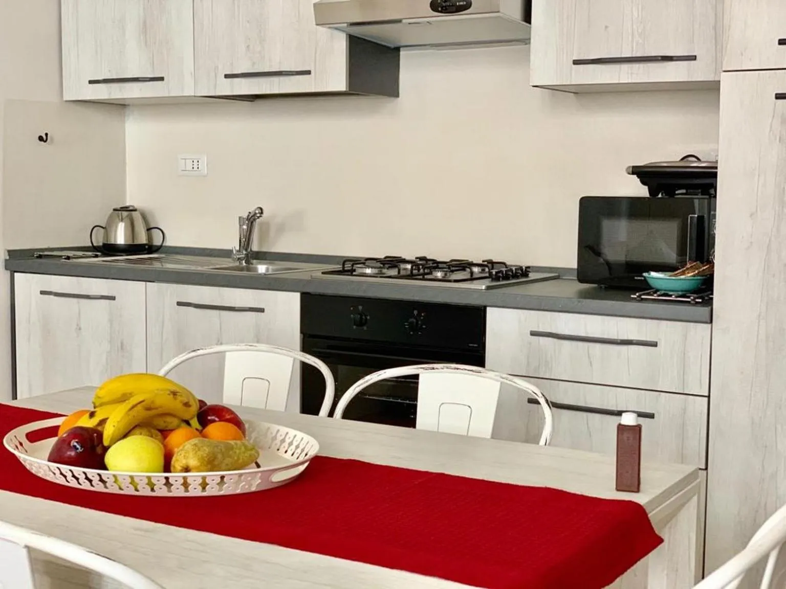 Kitchen or kitchenette in Regis Condo