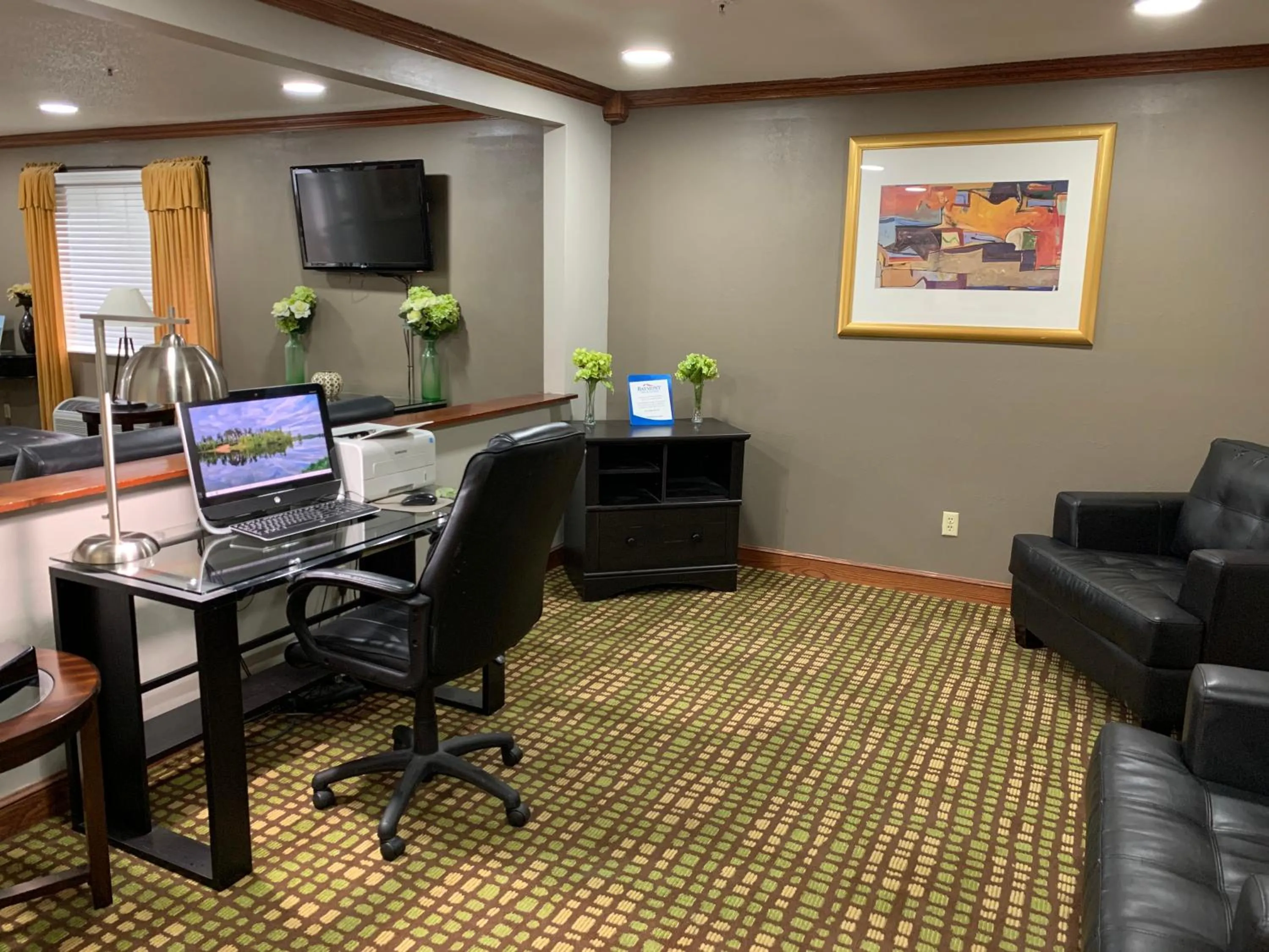 Seating area in Baymont by Wyndham Piqua