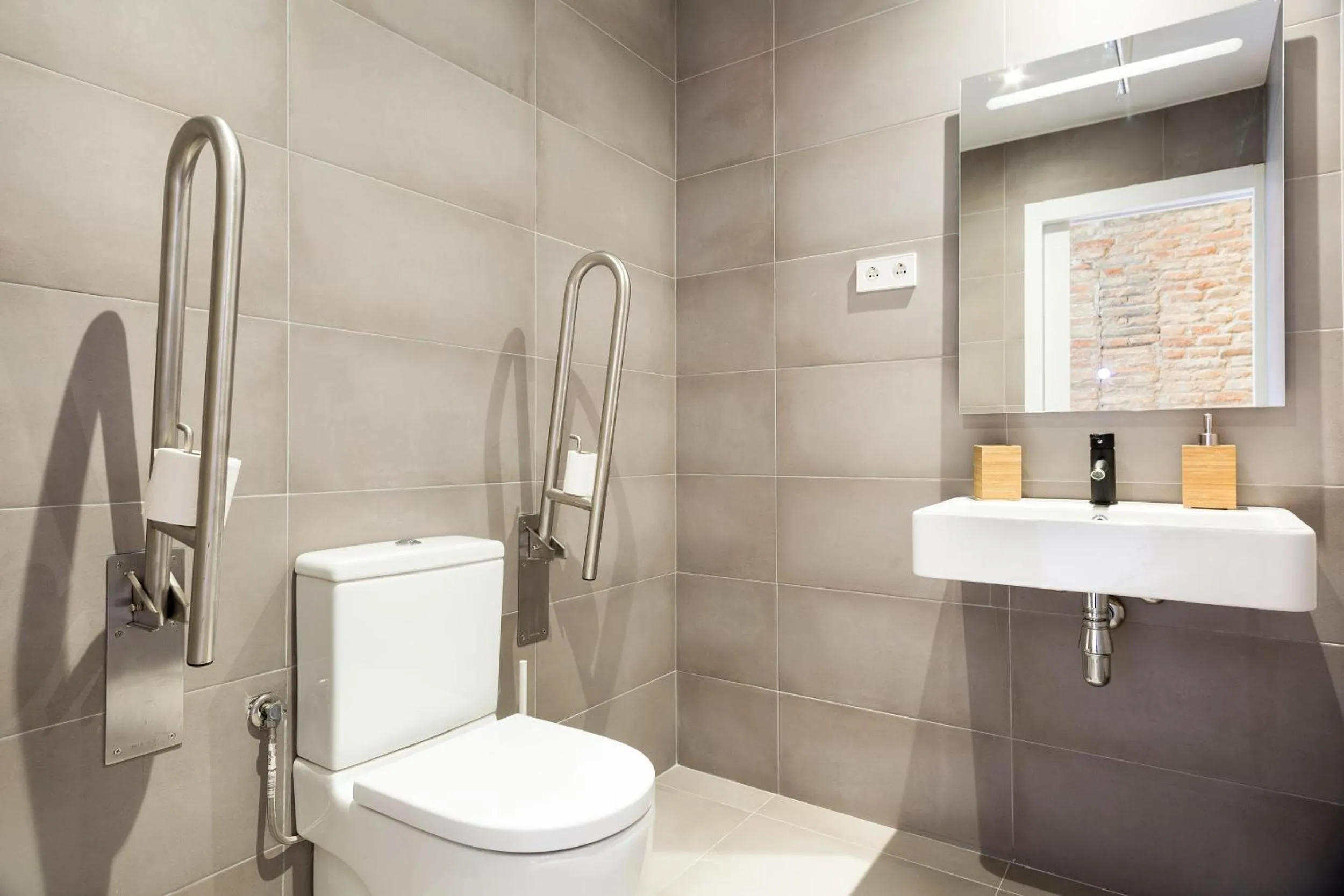 Toilet in Arte Suites by Olala Homes