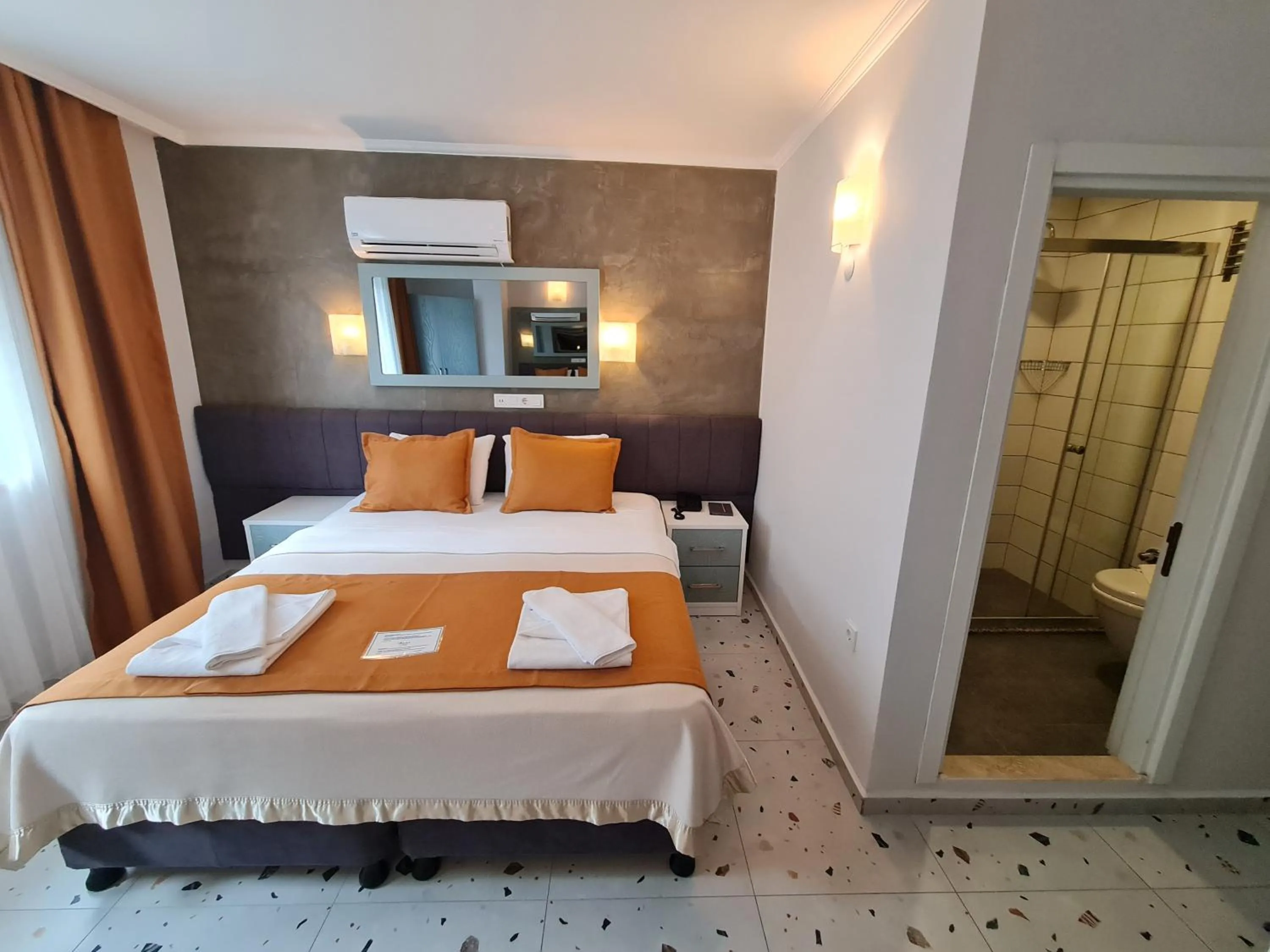 Bathroom, Bed in Tonoz Beach Hotel