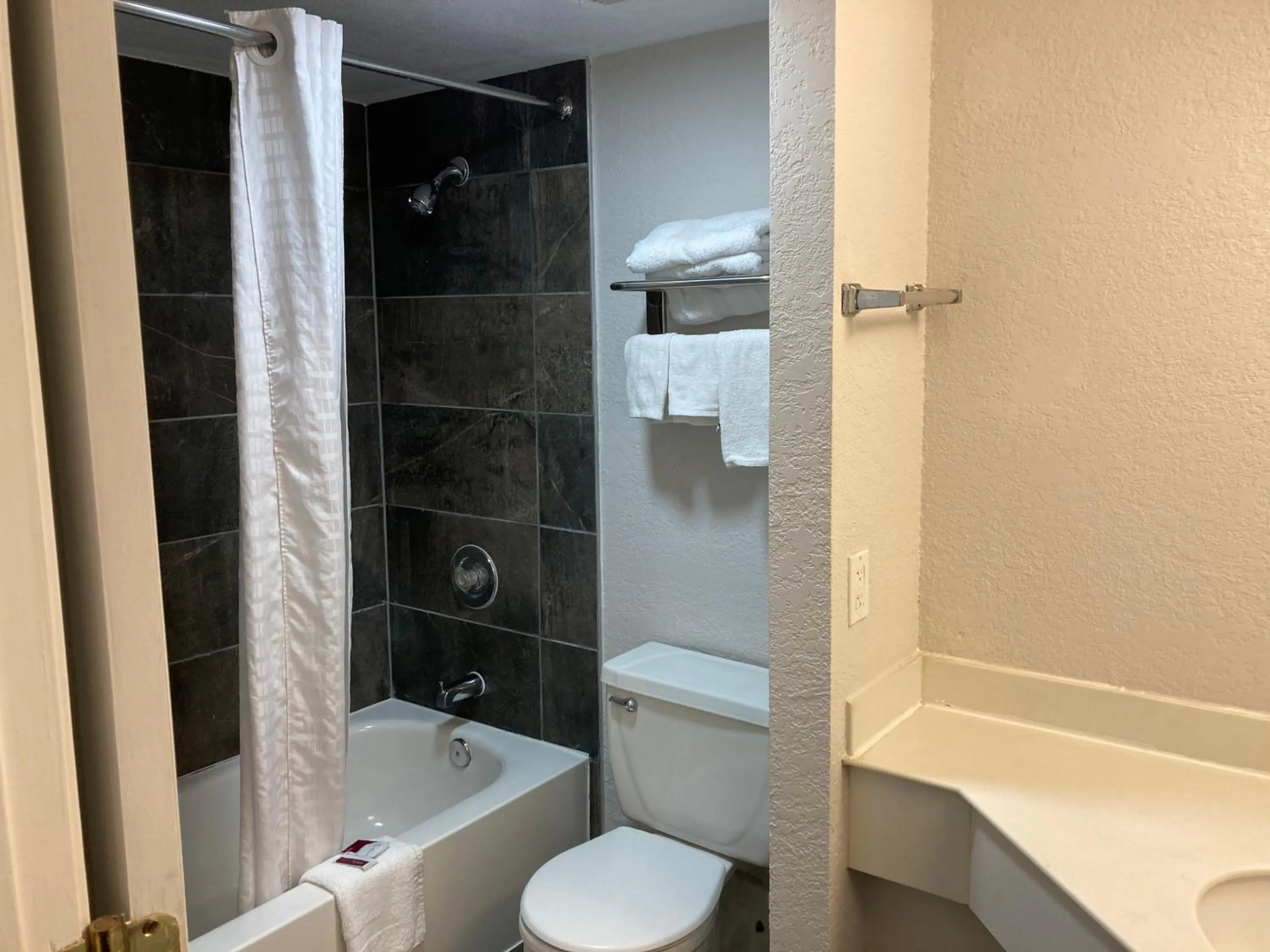 Shower in Budget Host Inn- Medical Center