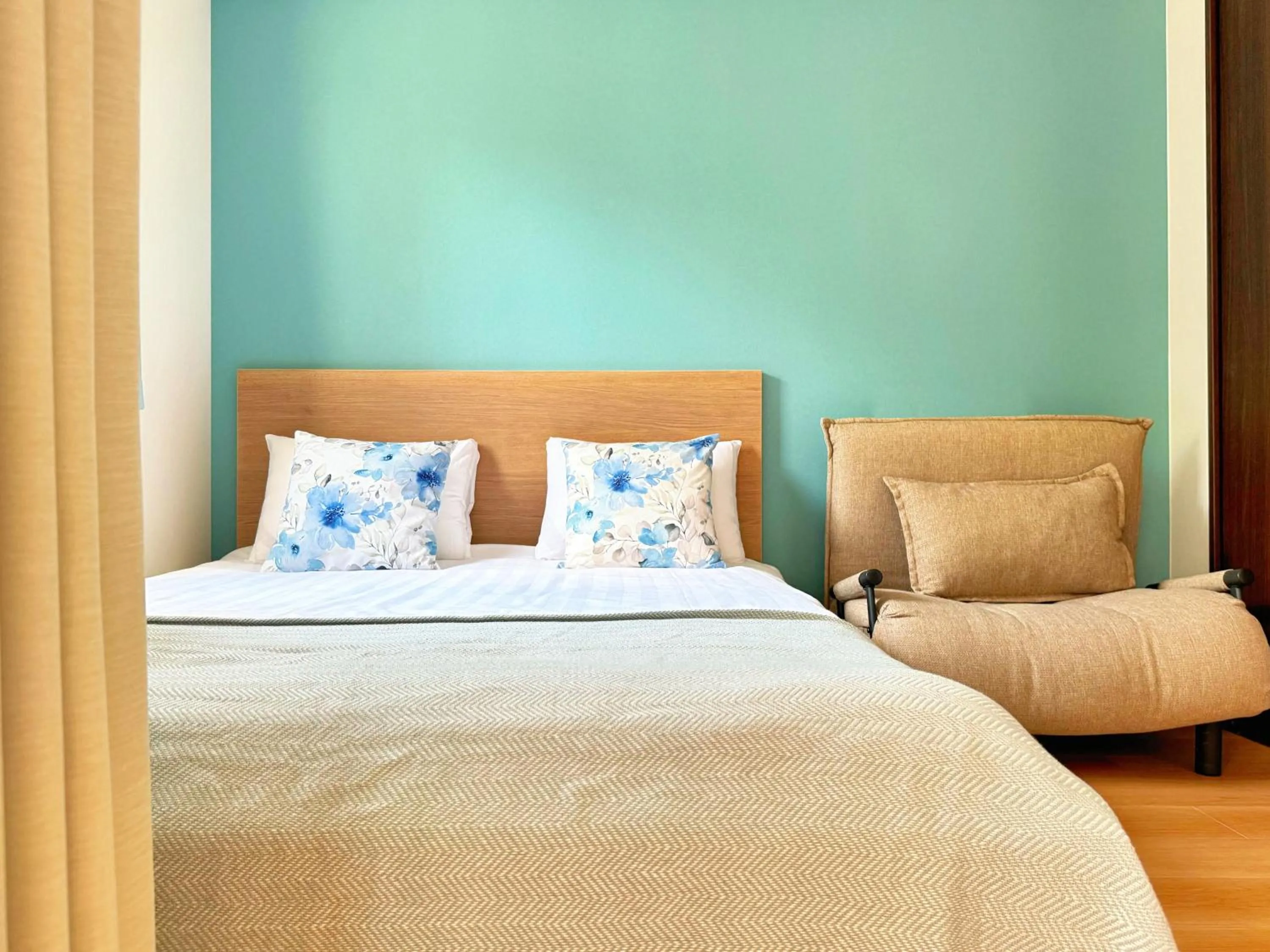 Bed in Juso AFP Apartment Hotel