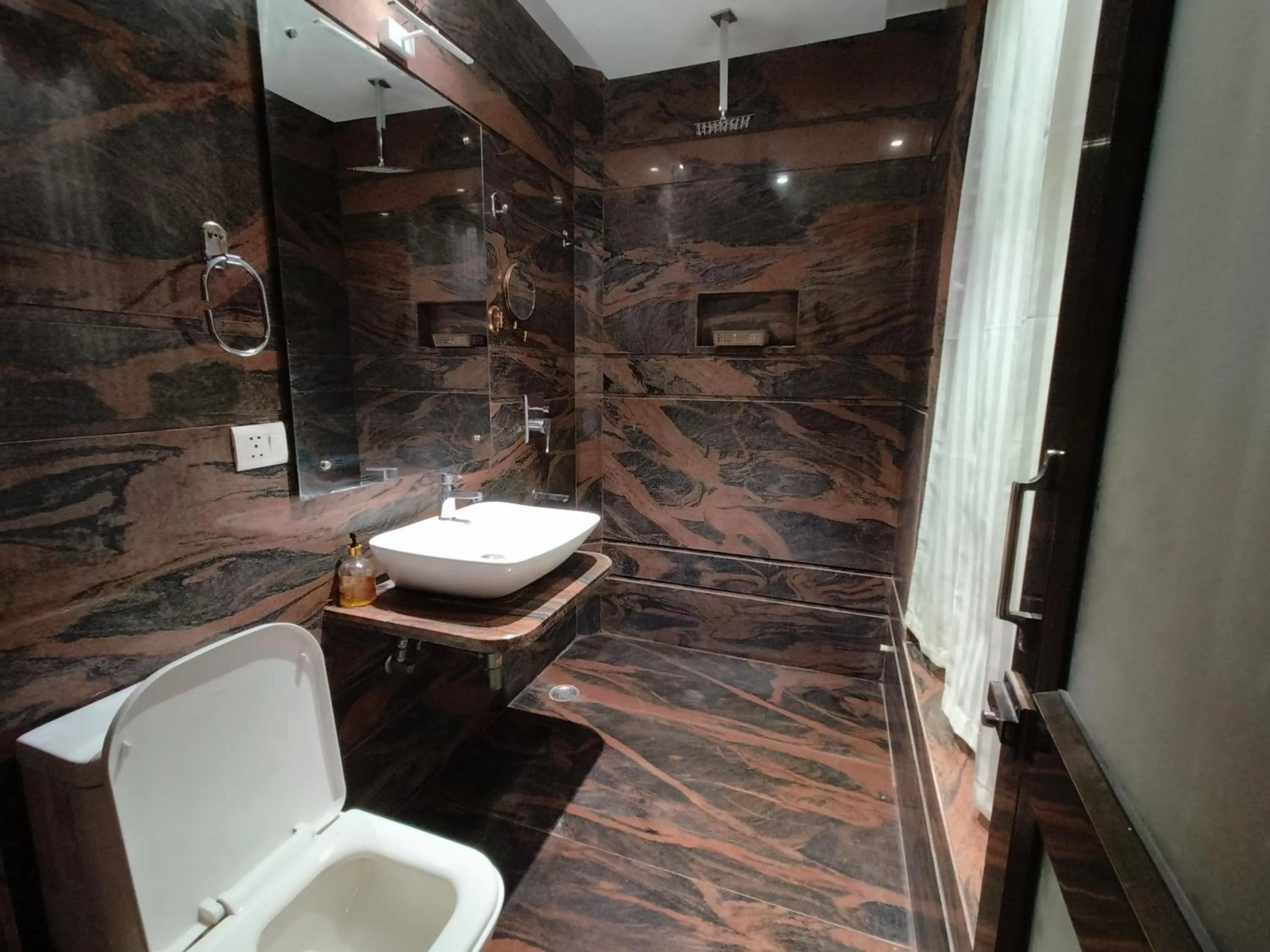 Bathroom in JJK Rukmini Vilas Hotel & Banquet