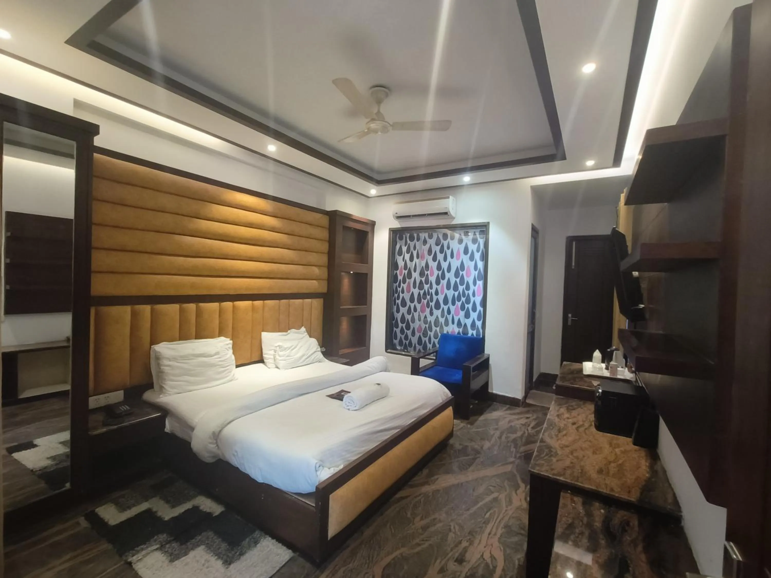 Bed in JJK Rukmini Vilas Hotel & Banquet