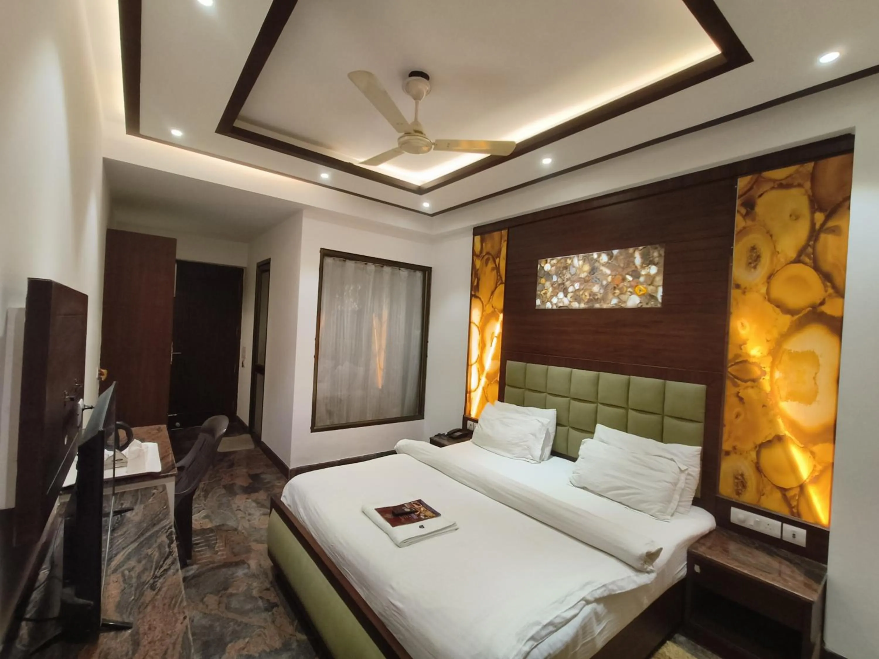 Bed in JJK Rukmini Vilas Hotel & Banquet