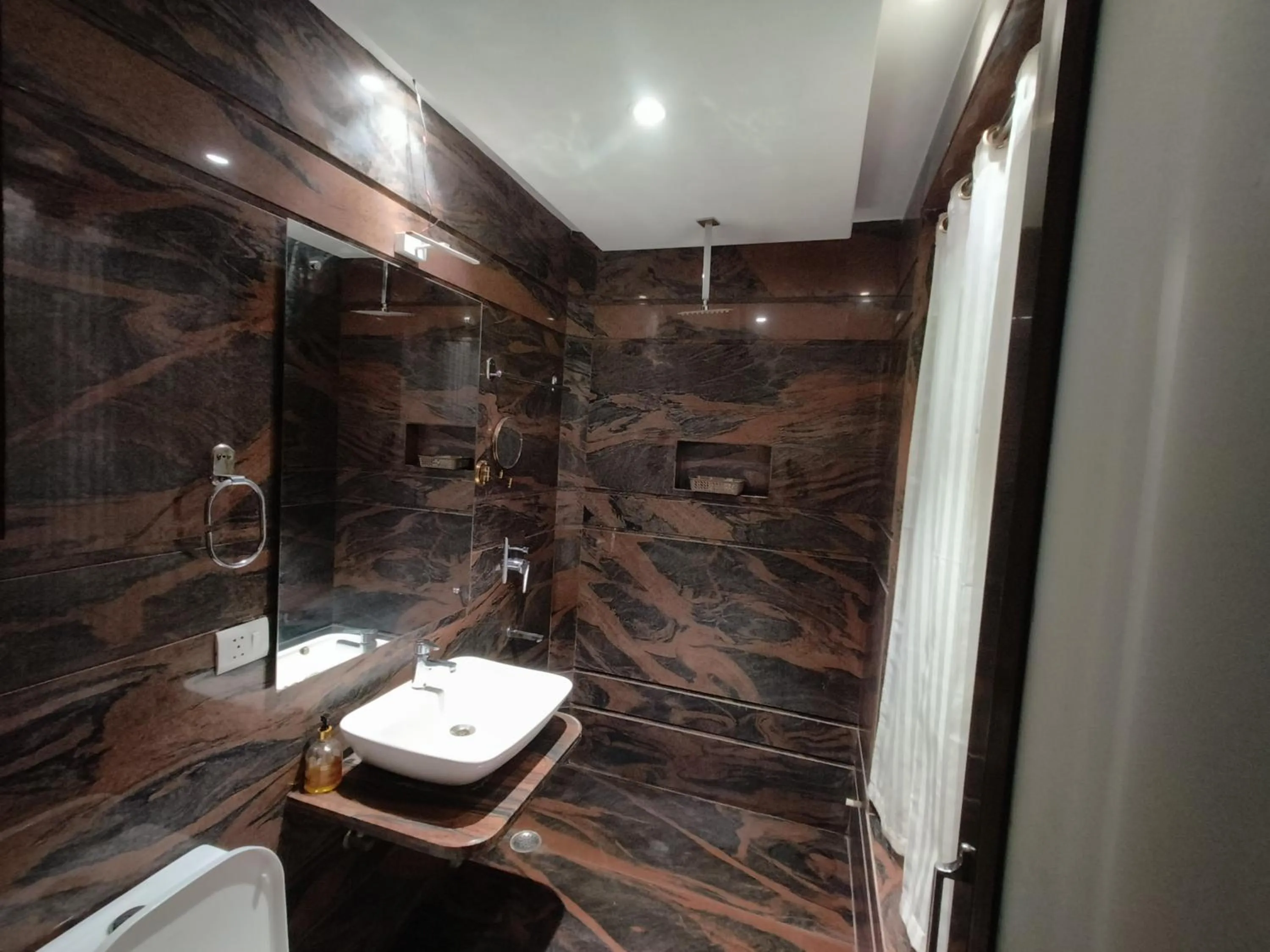 Bathroom in JJK Rukmini Vilas Hotel & Banquet