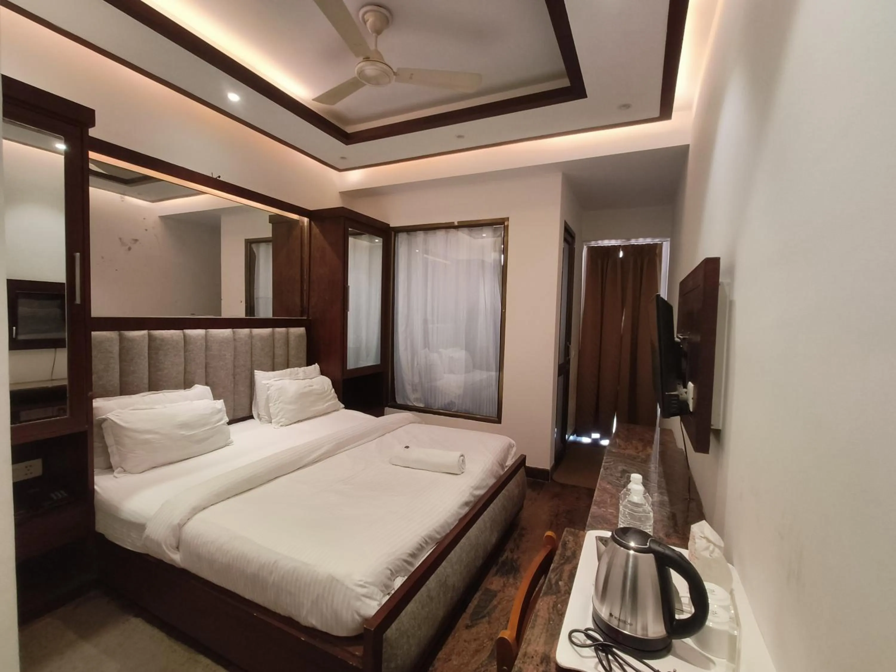 Bed in JJK Rukmini Vilas Hotel & Banquet