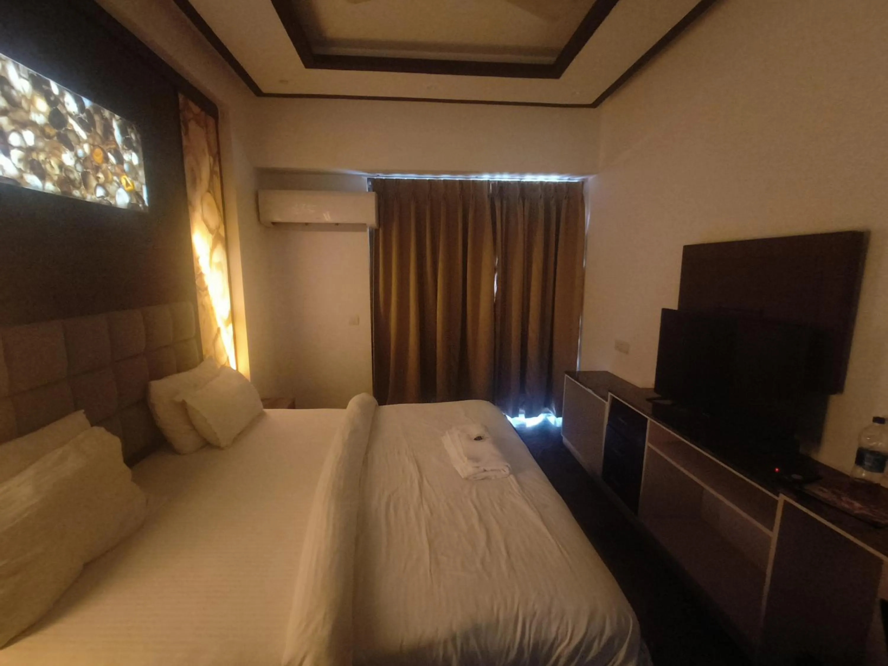 Bed in JJK Rukmini Vilas Hotel & Banquet