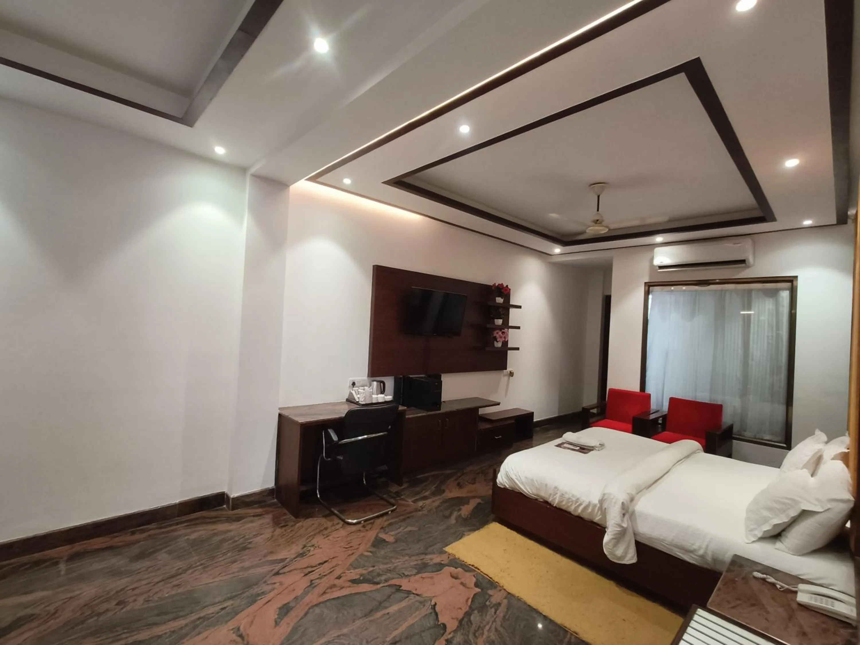 Bed in JJK Rukmini Vilas Hotel & Banquet