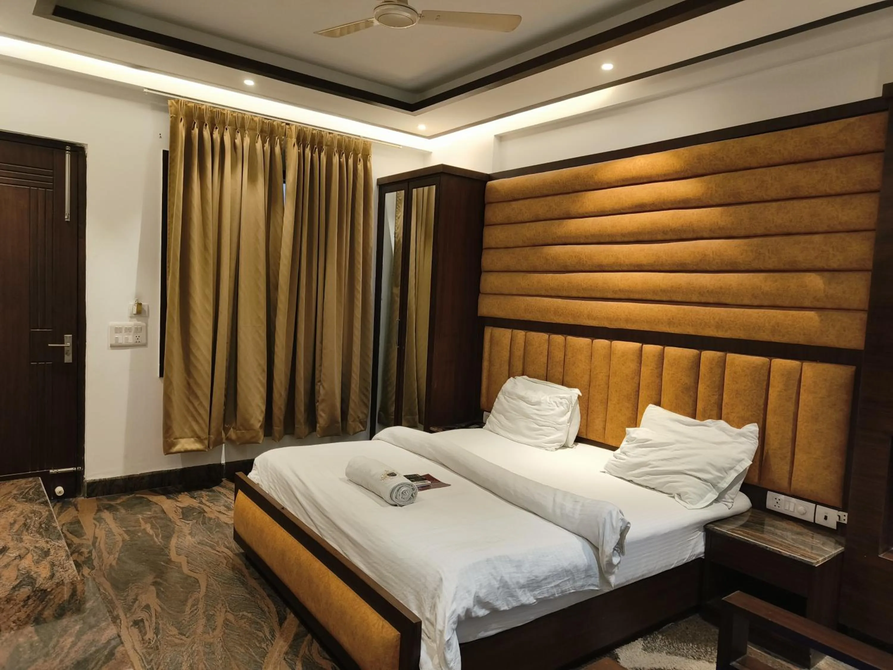 Bed in JJK Rukmini Vilas Hotel & Banquet