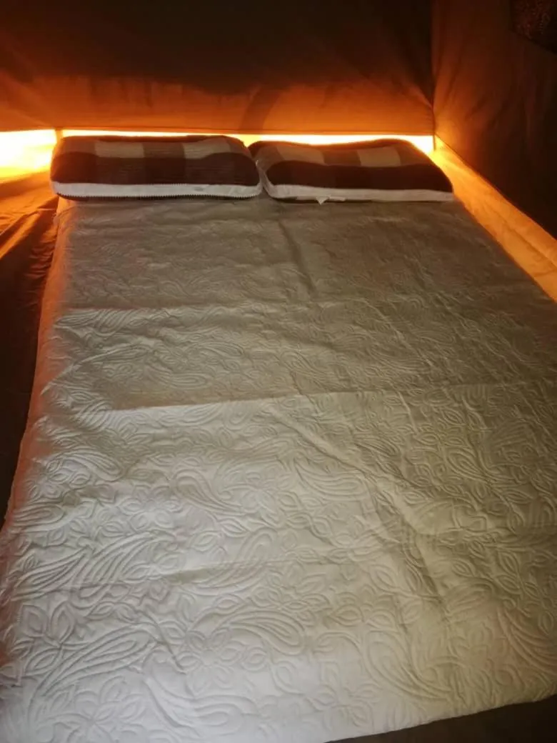 Bed in Nahubwe Safari Lodge