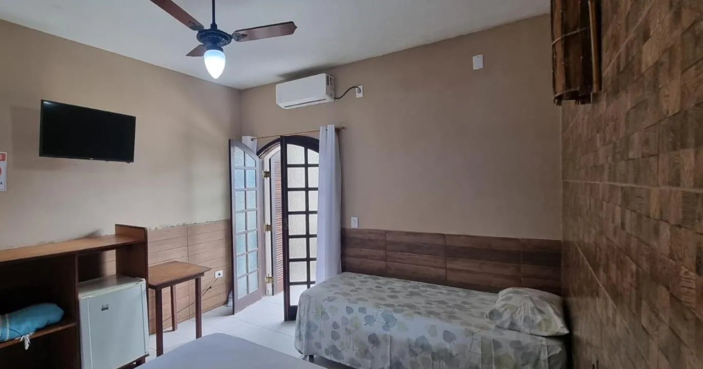 Bed in Pousada Boramar