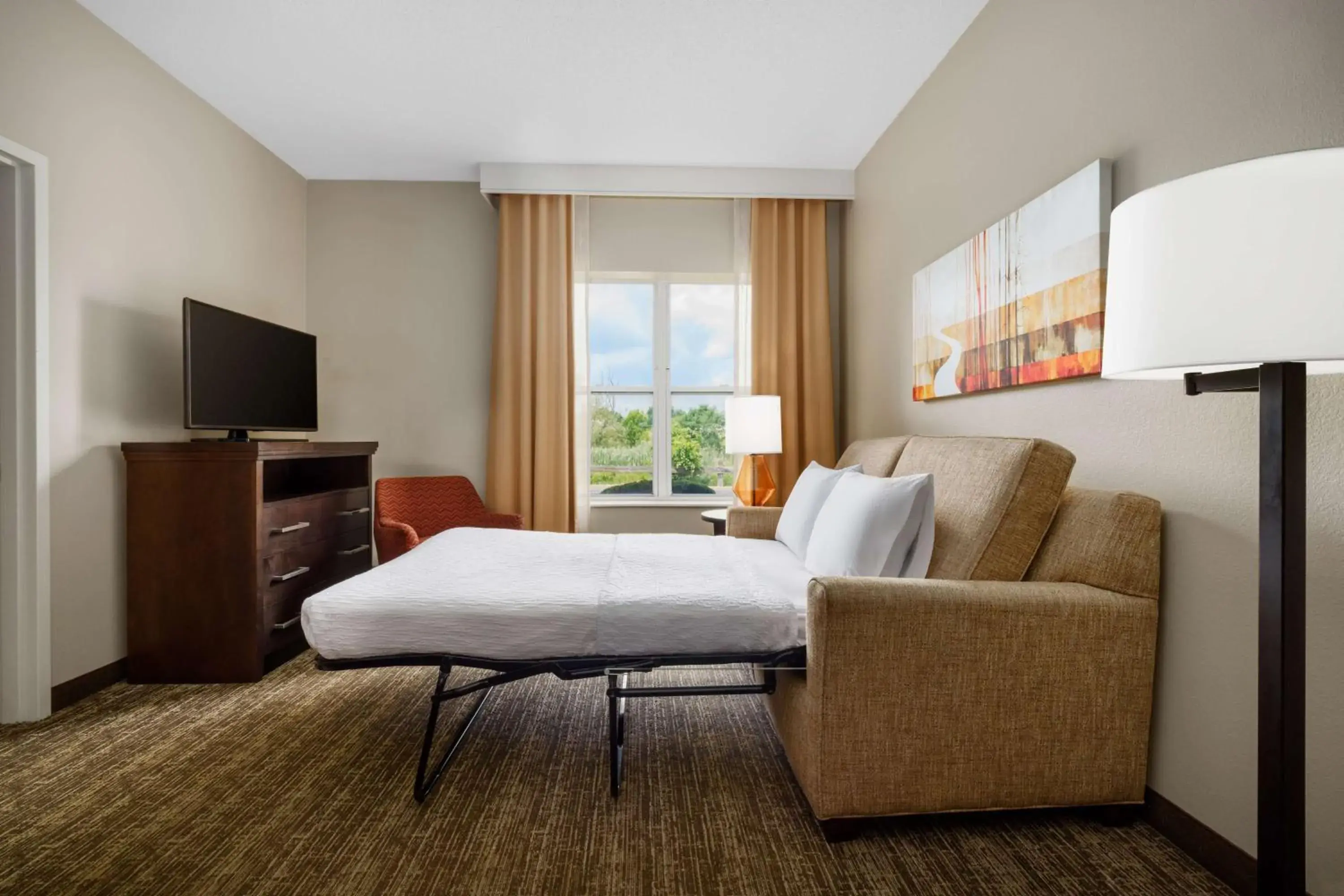 Living room, Bed in Homewood Suites Rochester-Henrietta Living room, Bed in Homewood Suites Rochester-Henrietta