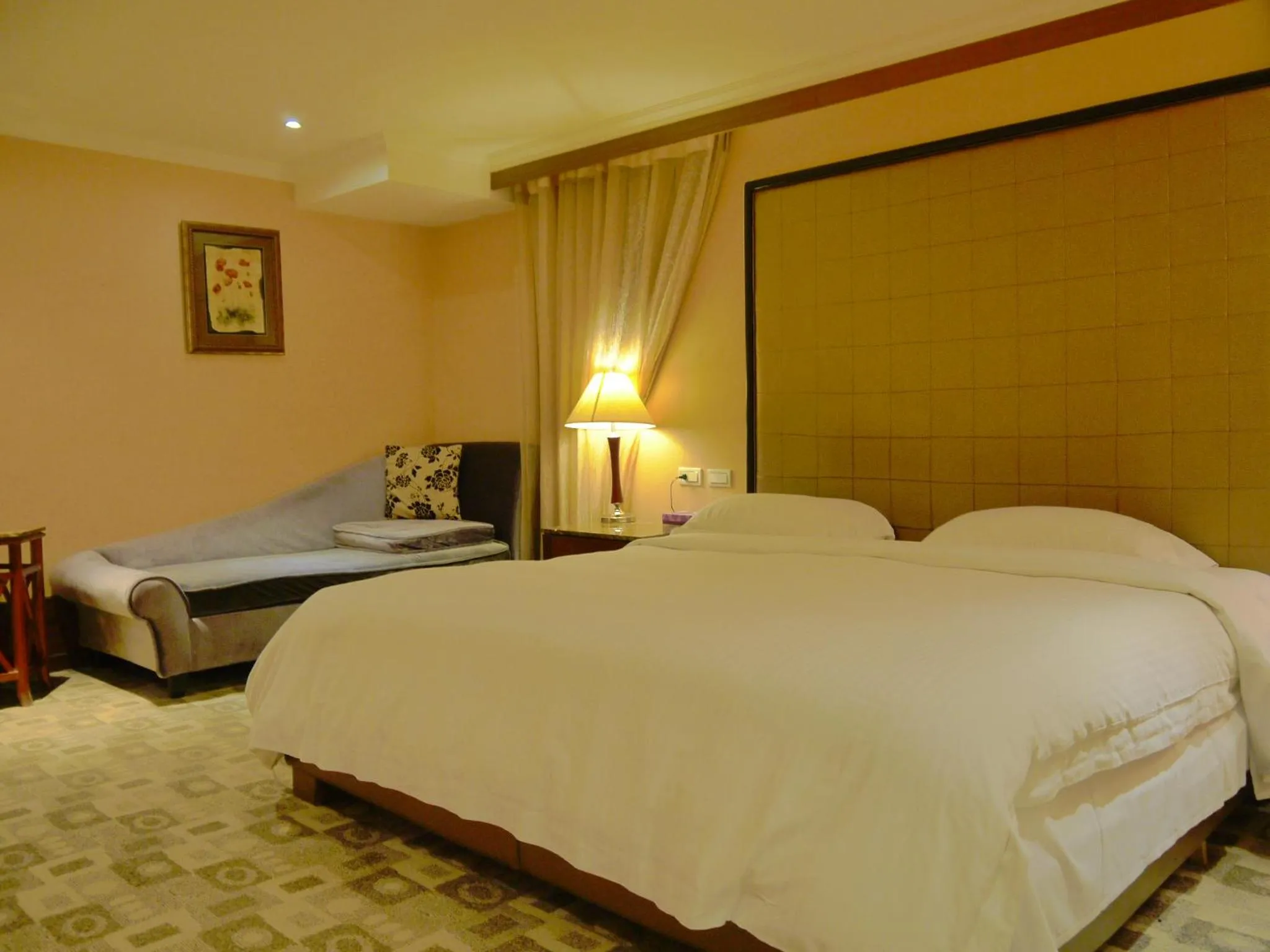 Bed in Kai Wei Boutique Hotel