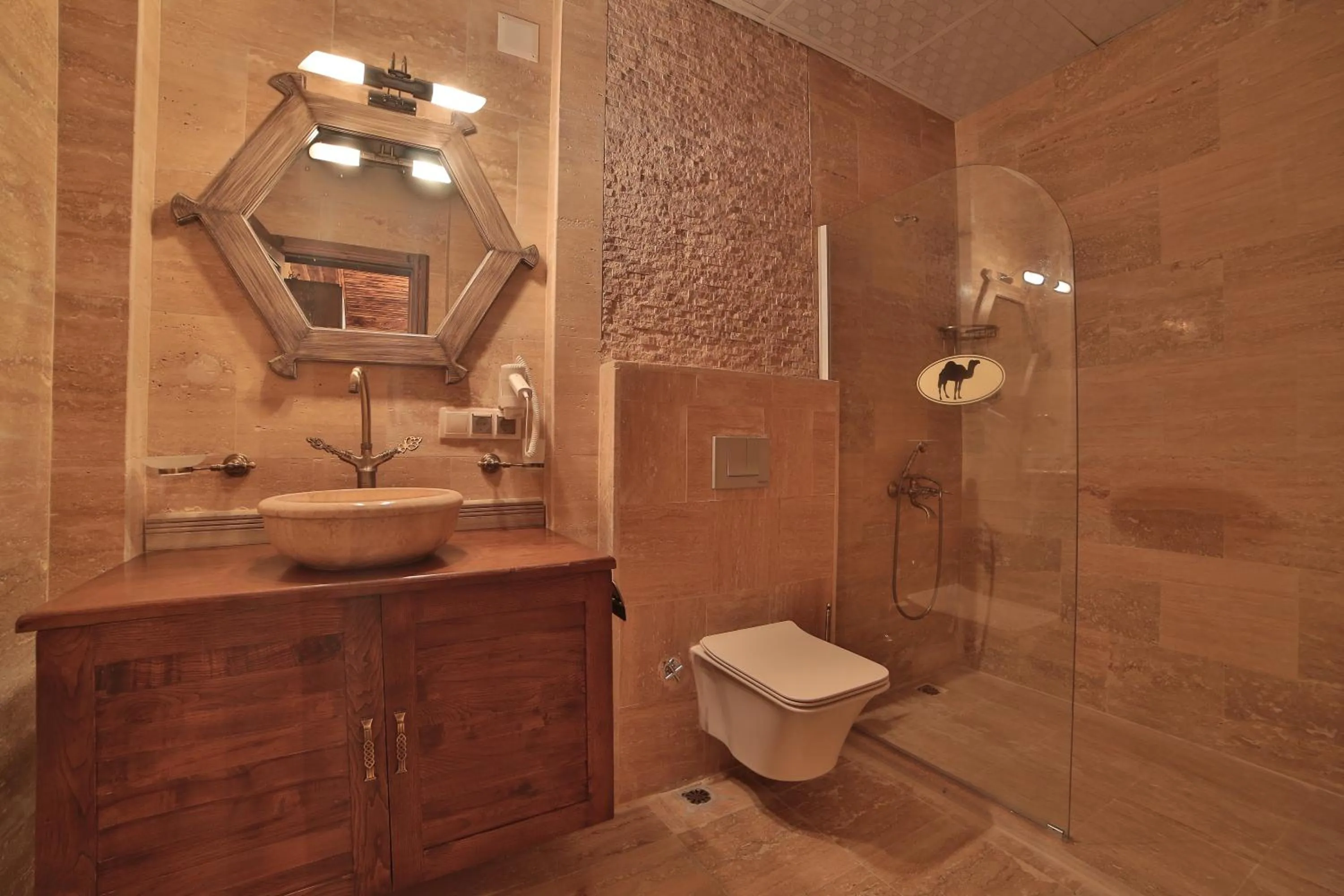 Shower in Caravanserai Inn Hotel