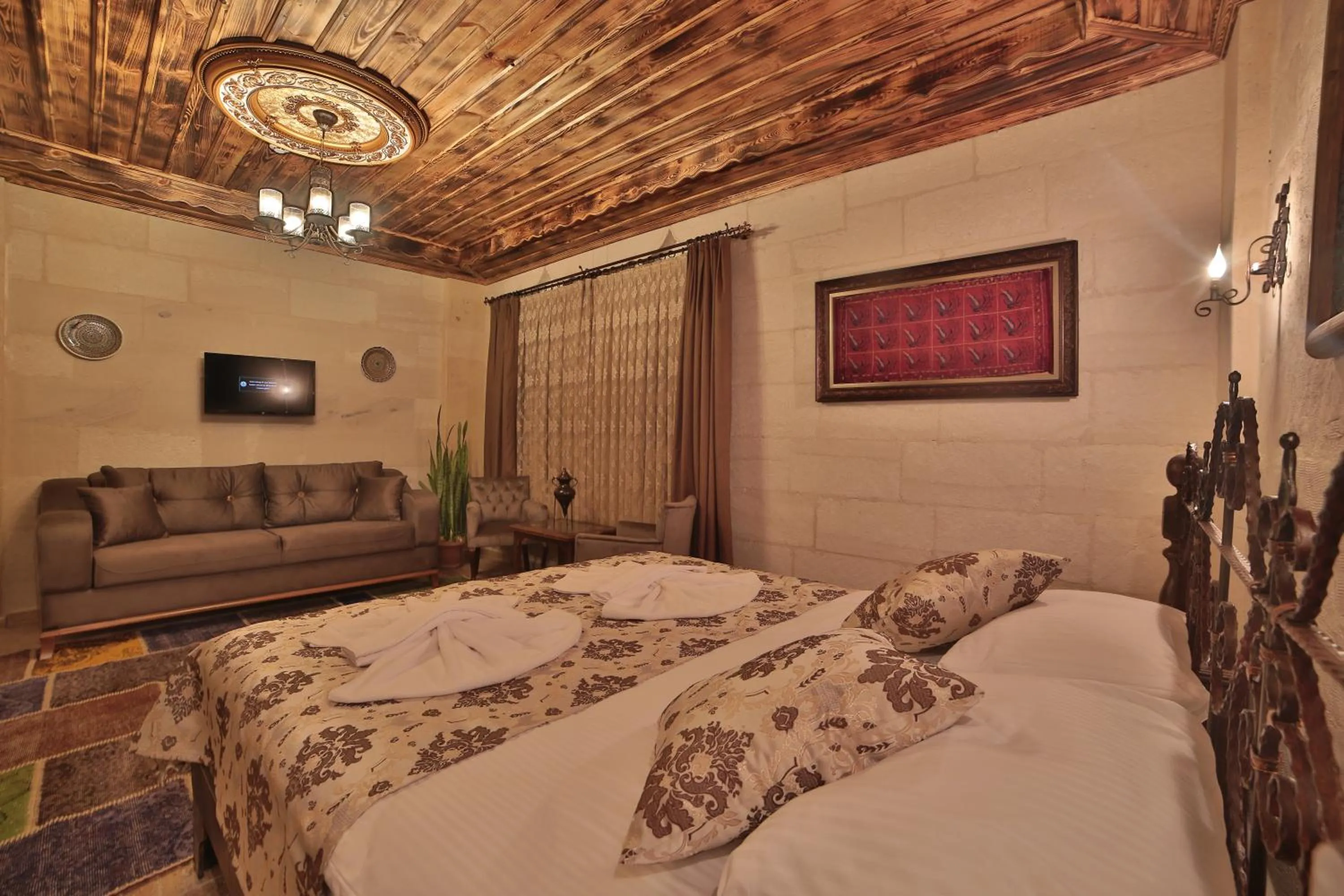 Bed in Caravanserai Inn Hotel