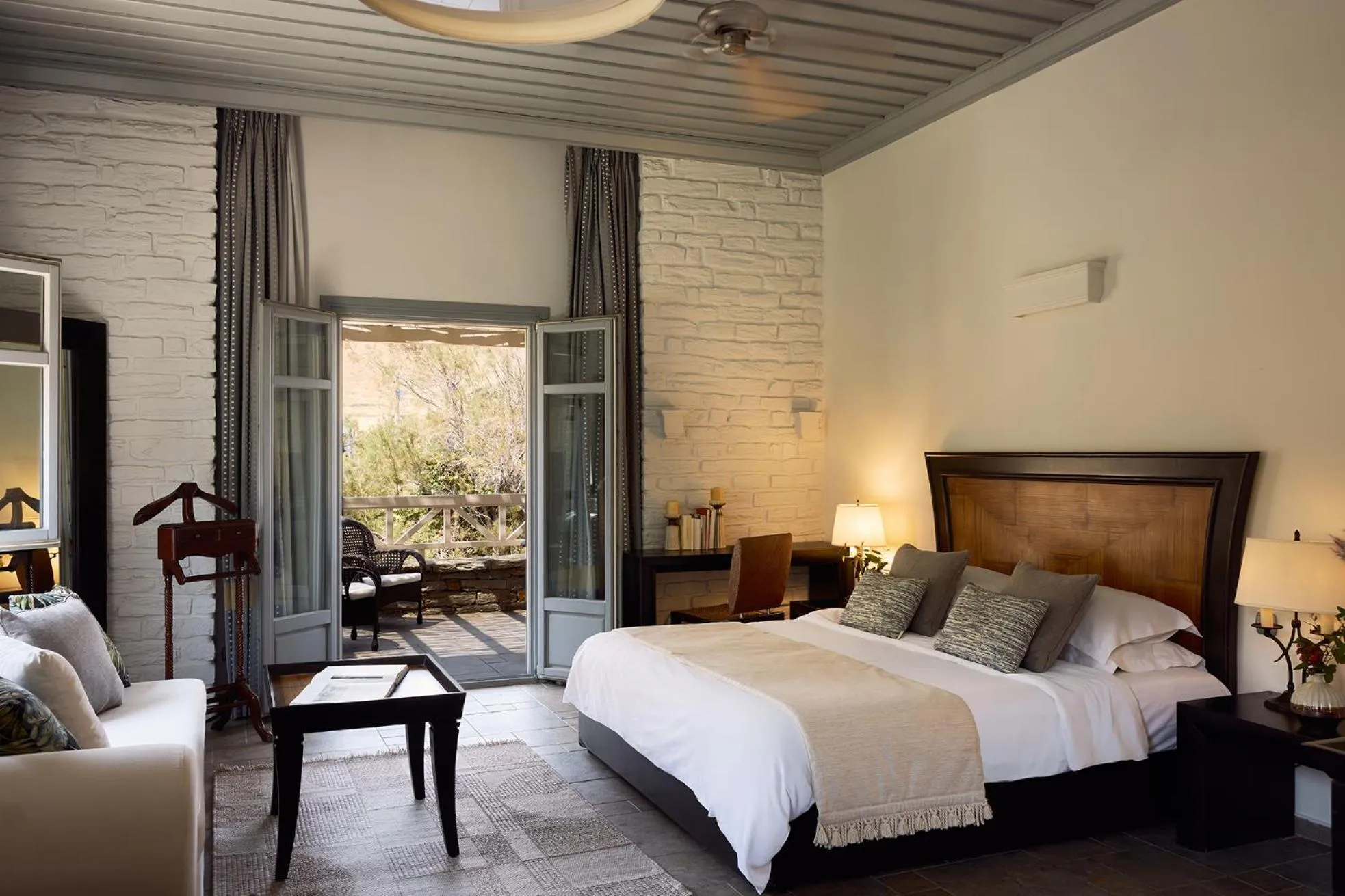 Photo of the whole room, Bed in Porto Kea Suites by Sandglass