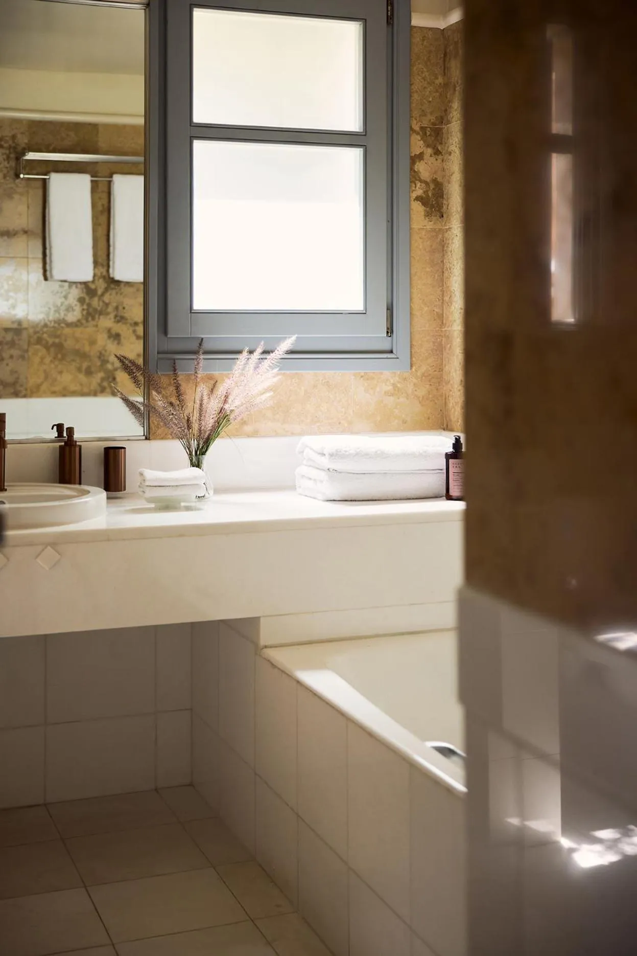 Bathroom in Porto Kea Suites by Sandglass