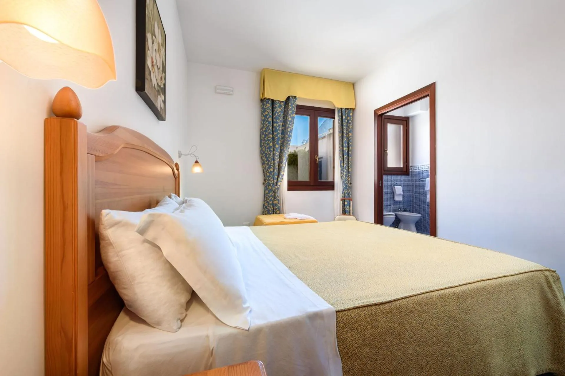Bed in La Meridiana Hotel