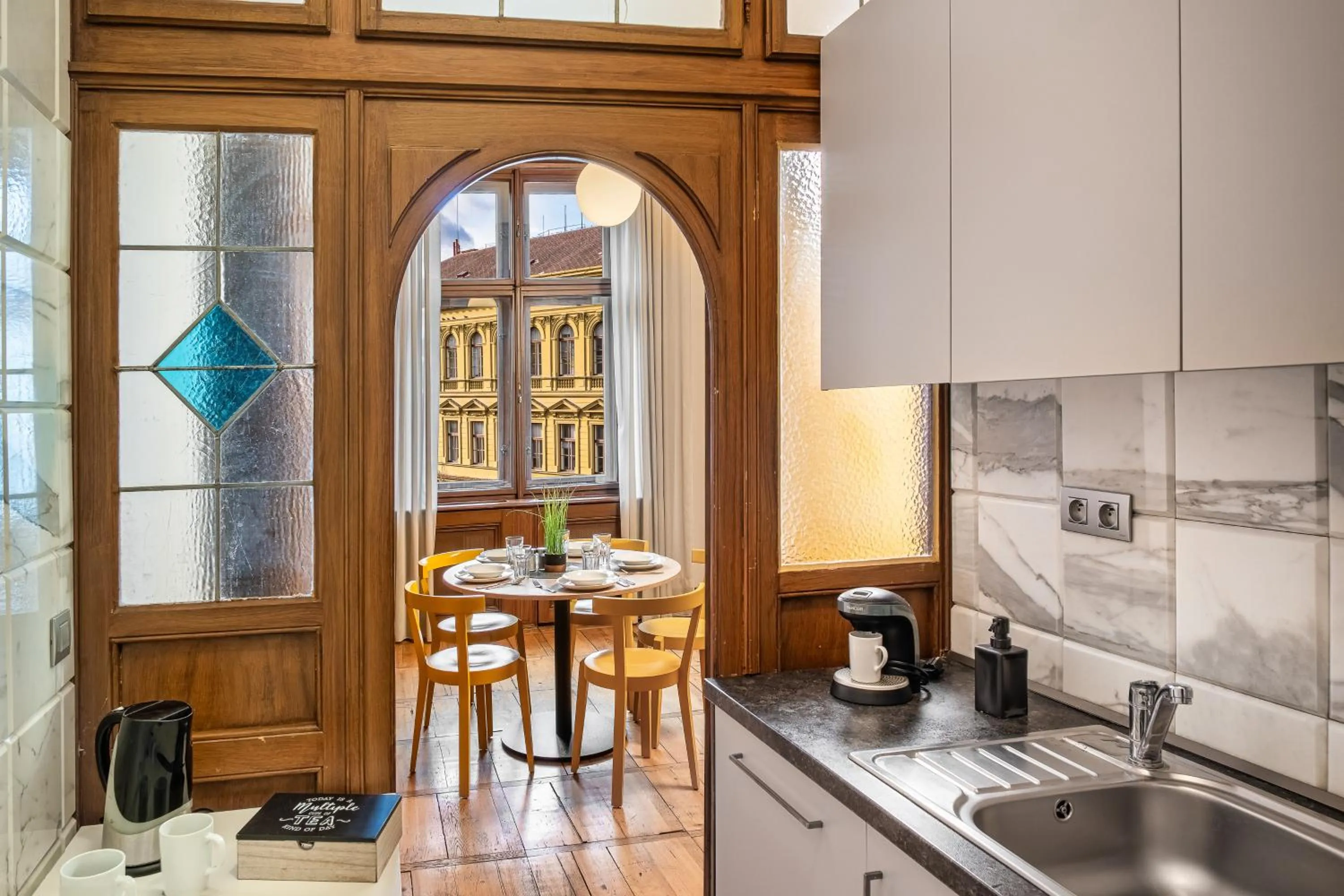 Kitchen or kitchenette in Art House Apartments by Adrez