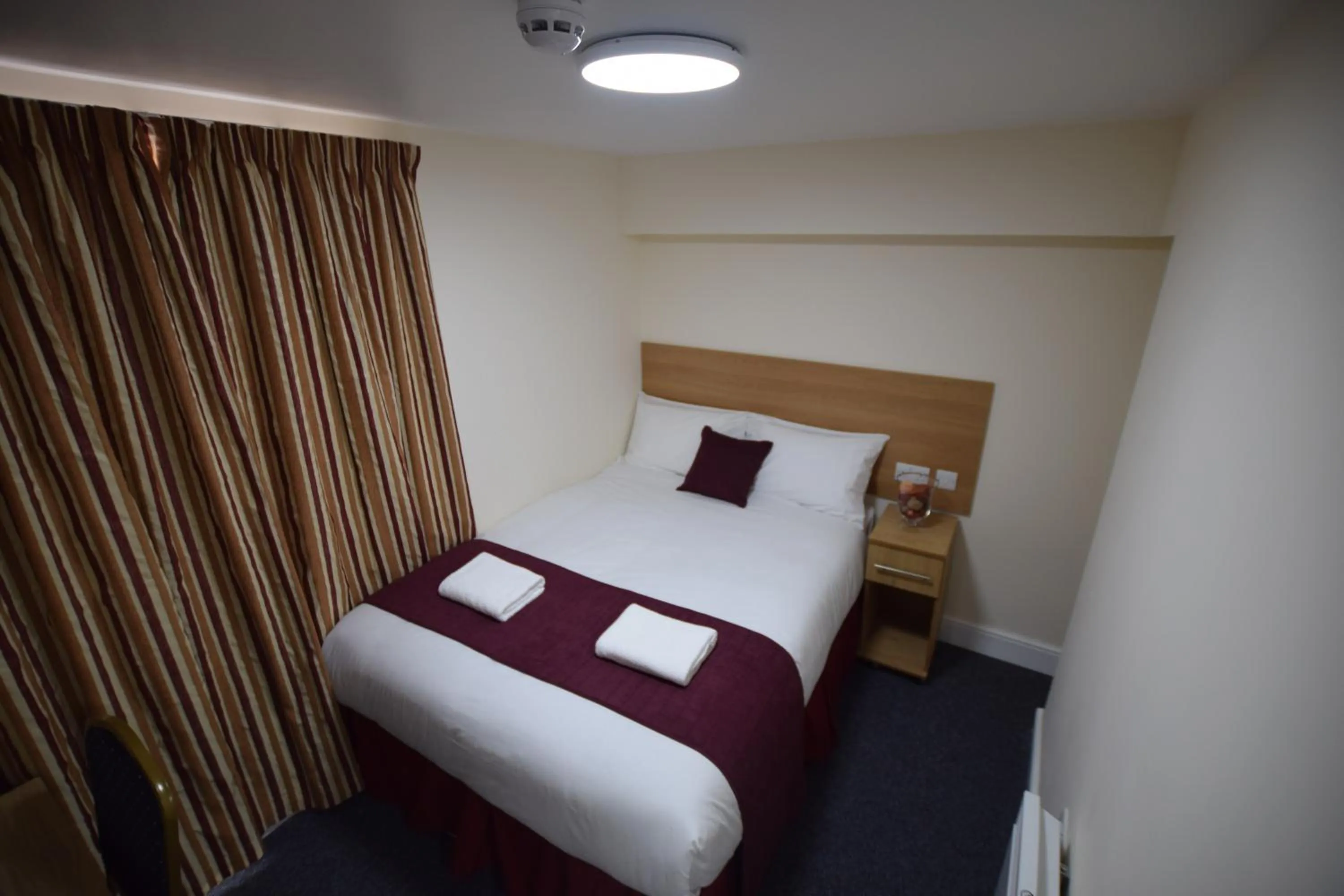 Bedroom, Bed in PremierLux Serviced Apartments