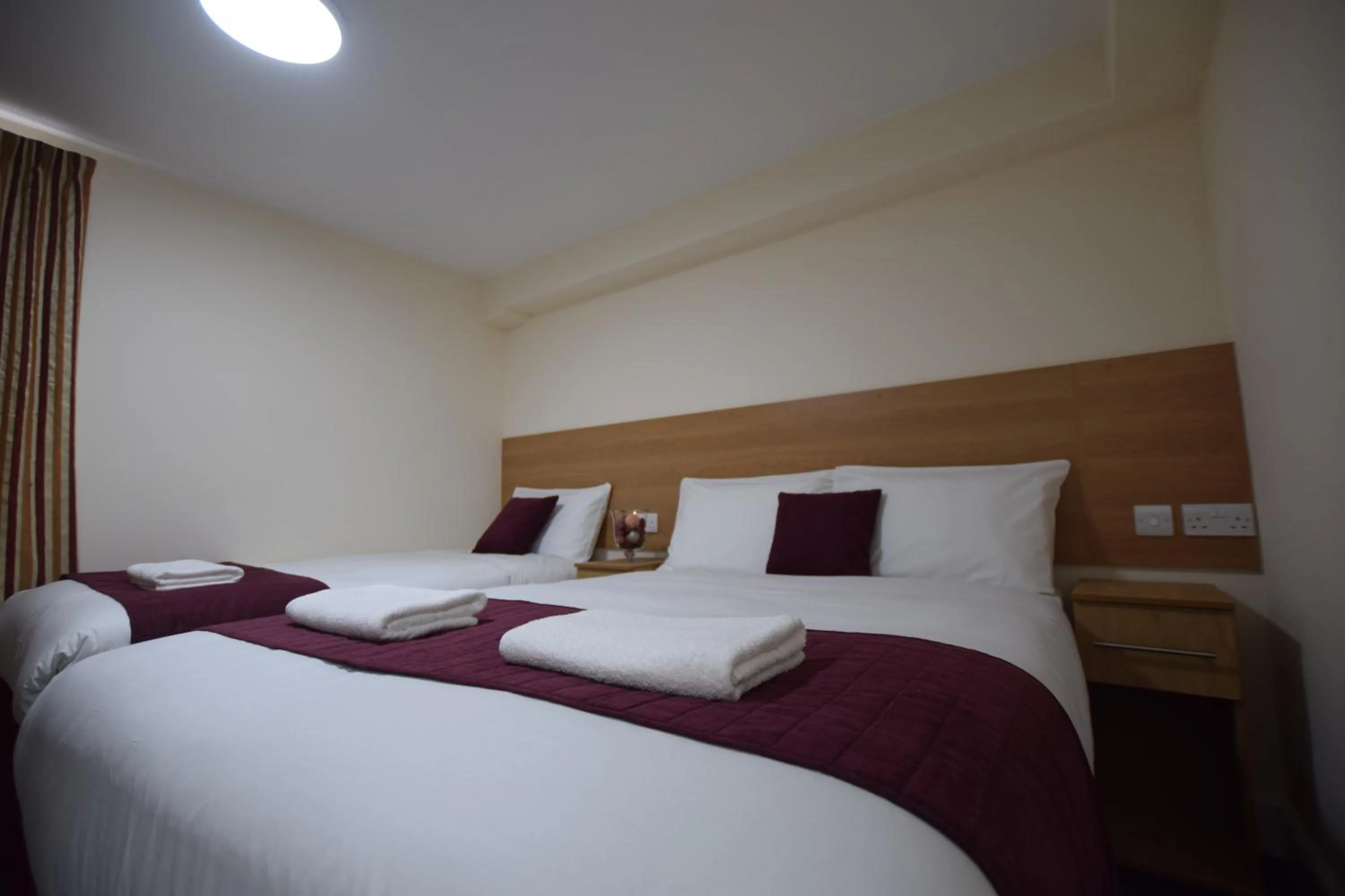 Bedroom, Bed in PremierLux Serviced Apartments