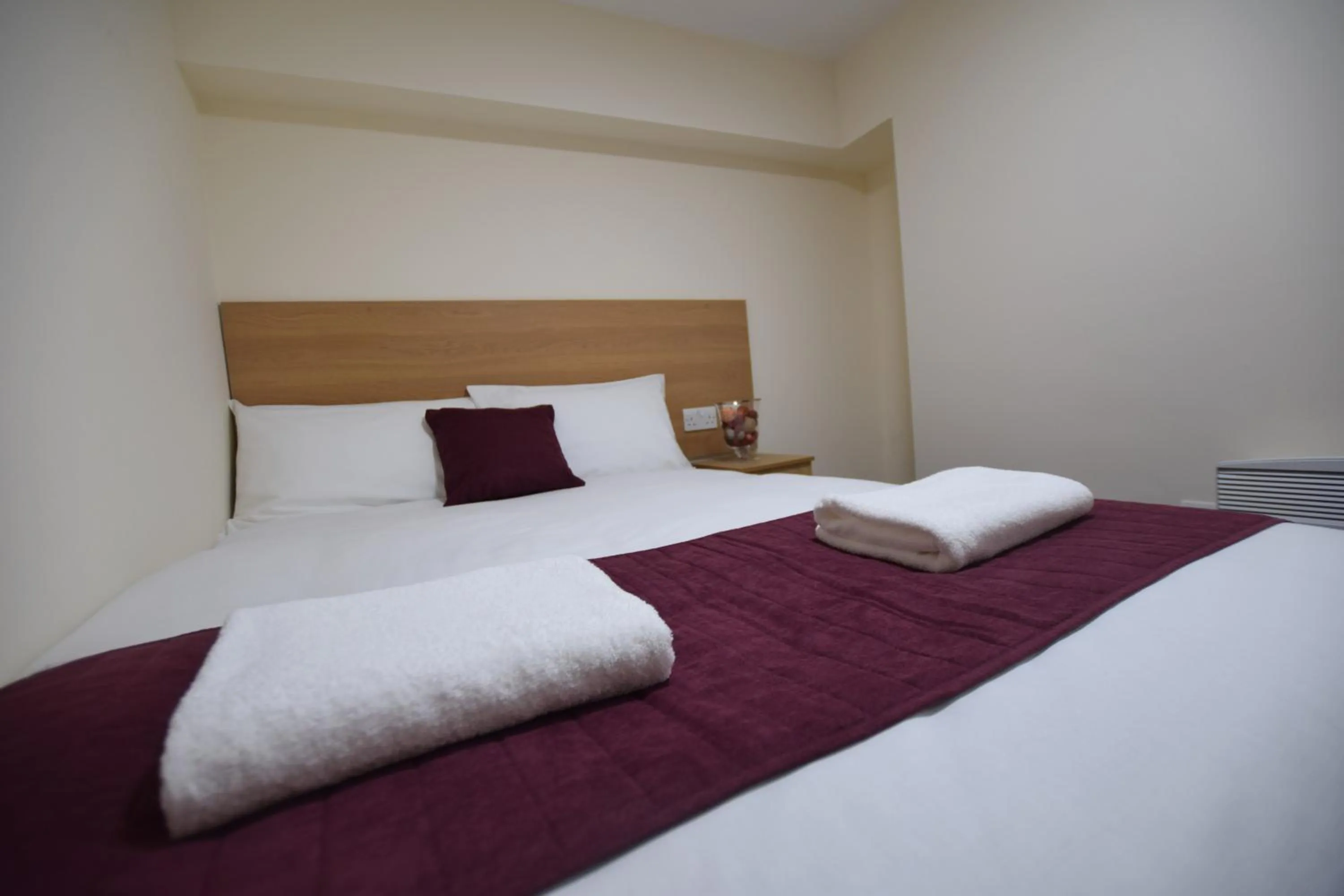 Bedroom, Bed in PremierLux Serviced Apartments