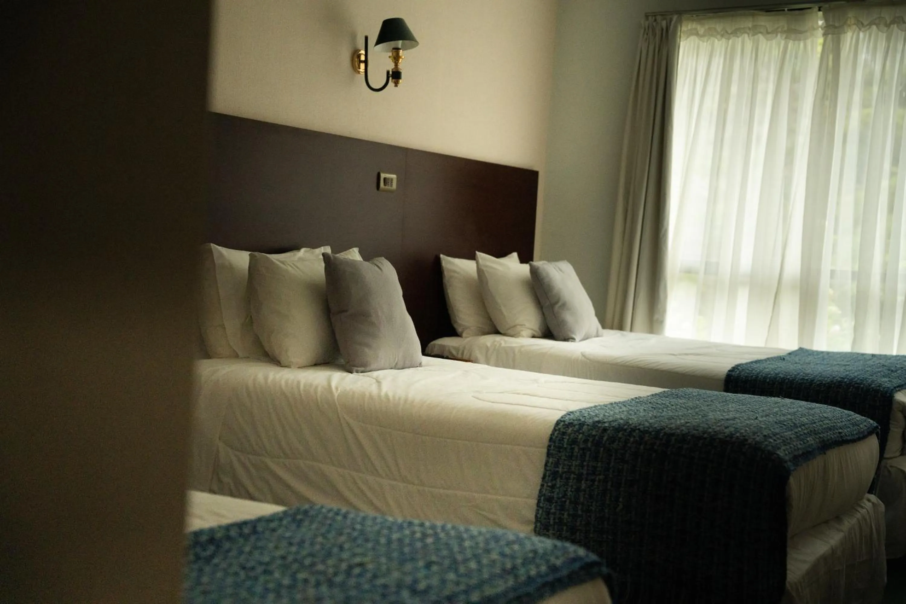 Bed in Hotel HD Natales