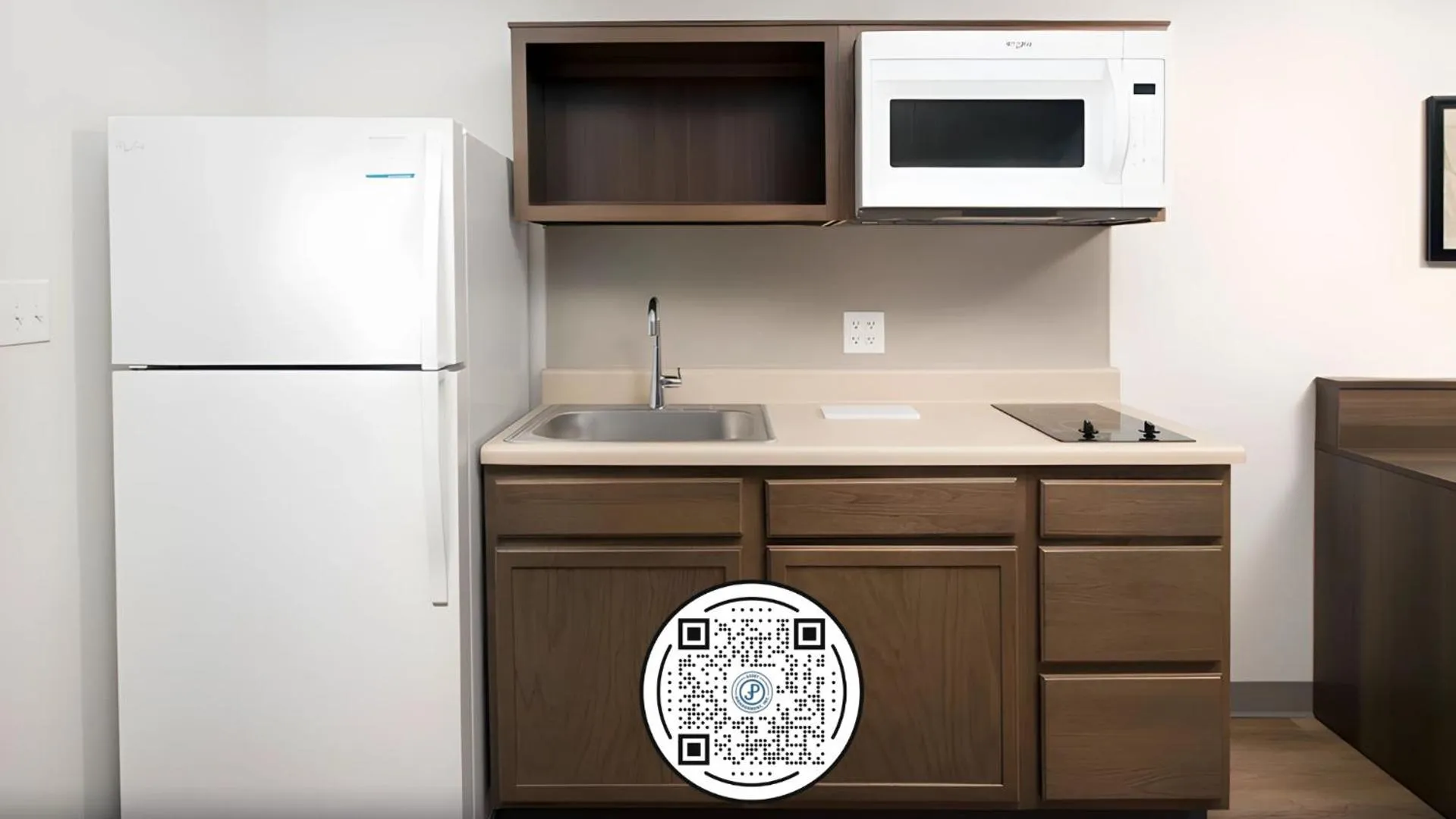 Kitchen or kitchenette in Woodspring Suites Orlando International Drive