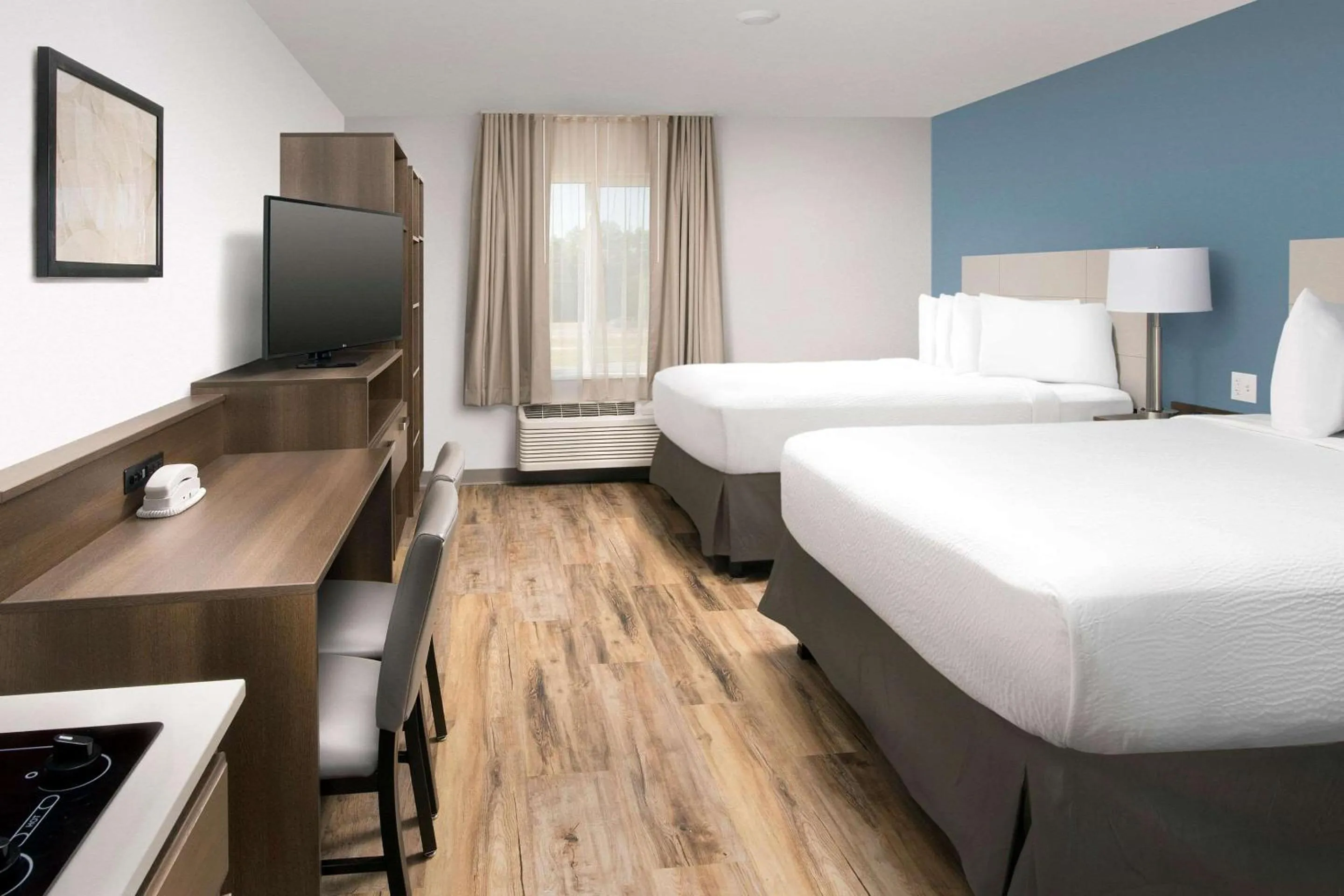 Photo of the whole room, Bed in Woodspring Suites Orlando International Drive