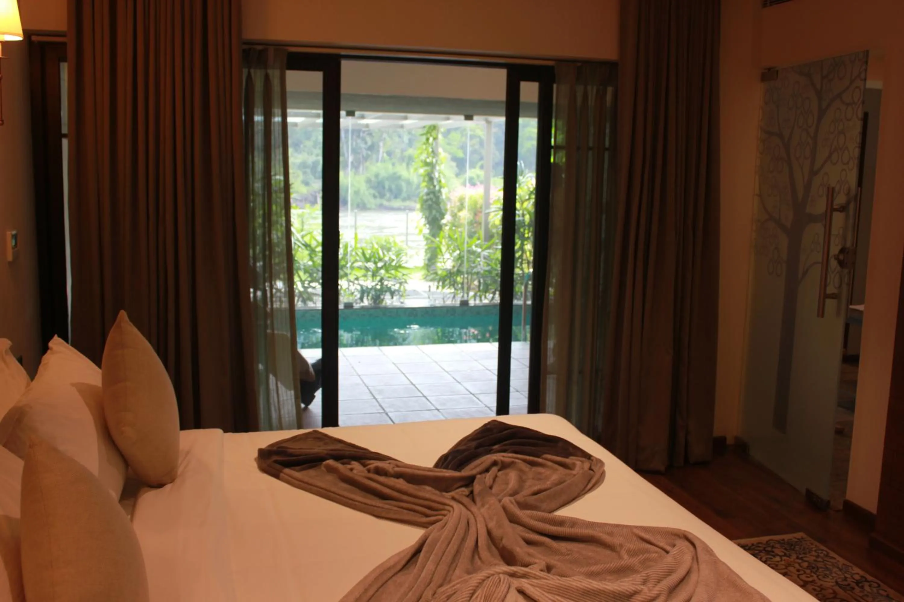 Bed in Niraamaya Retreats Samroha Athirappilly
