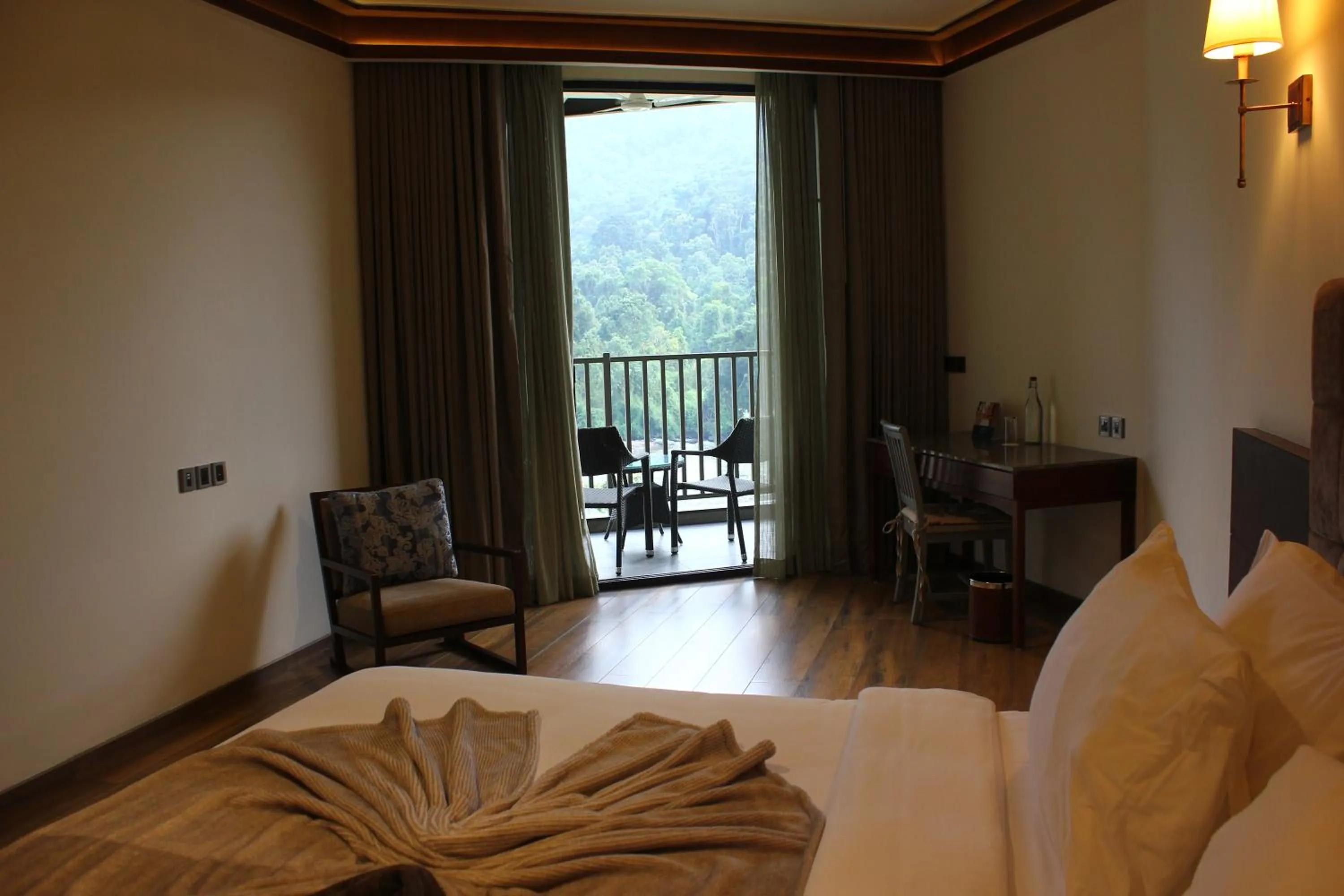 Photo of the whole room, Bed in Niraamaya Retreats Samroha Athirappilly