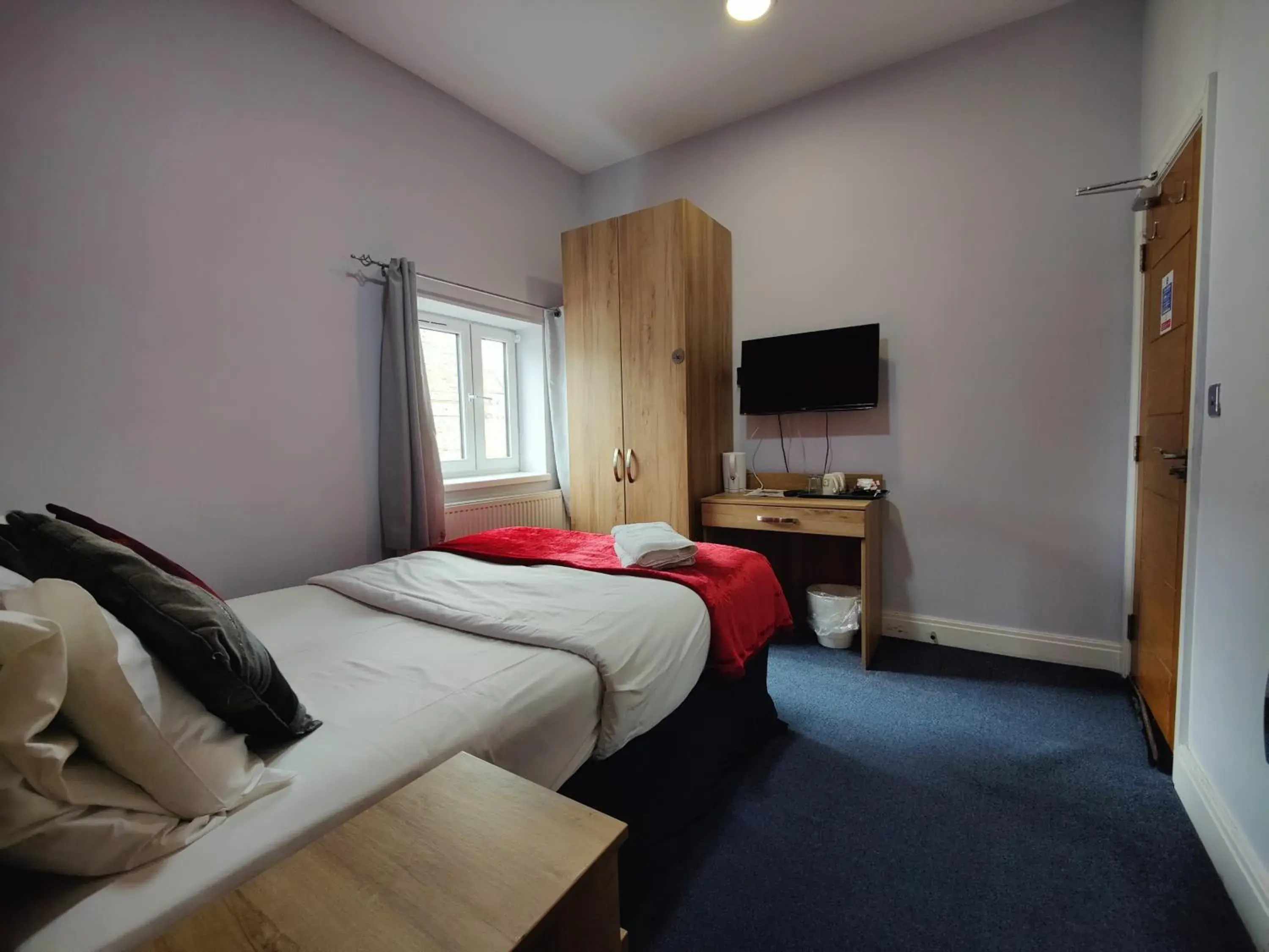 Bed in Wellesley Hotel Bed in Wellesley Hotel