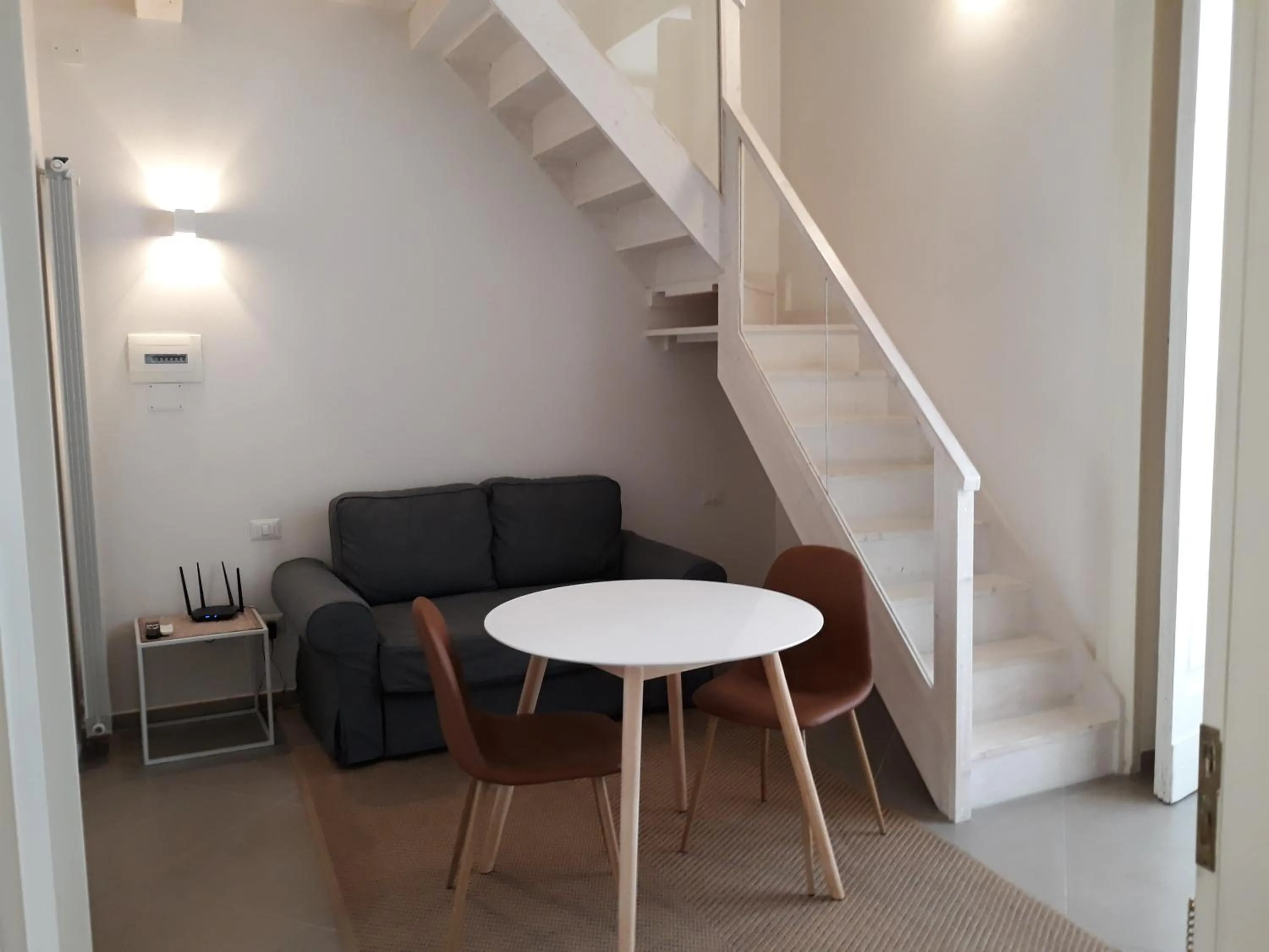 Seating area in Piano Nobile by Napoliapartments