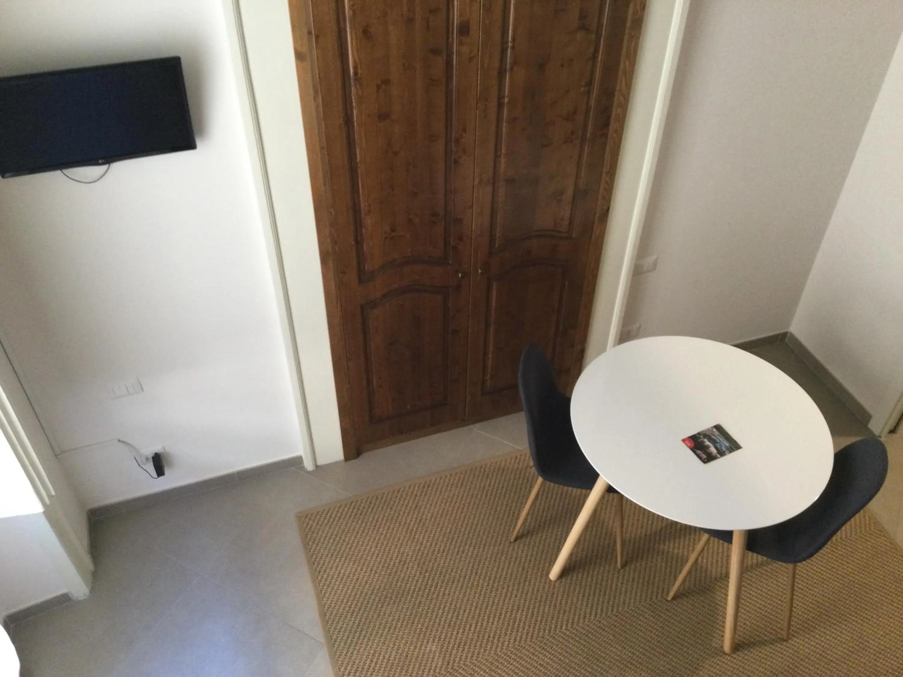 Dining area in Piano Nobile by Napoliapartments