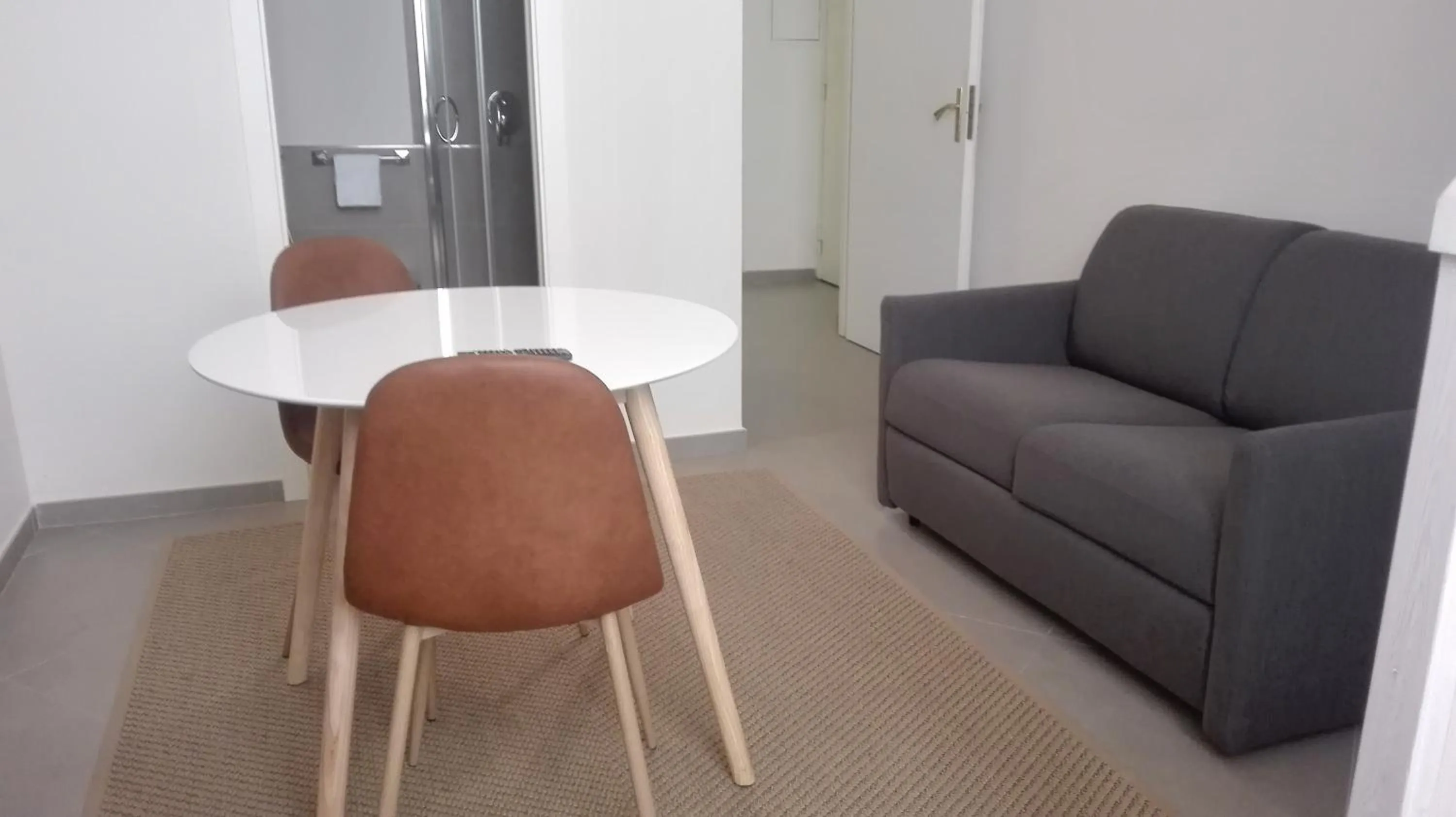 Seating area in Piano Nobile by Napoliapartments