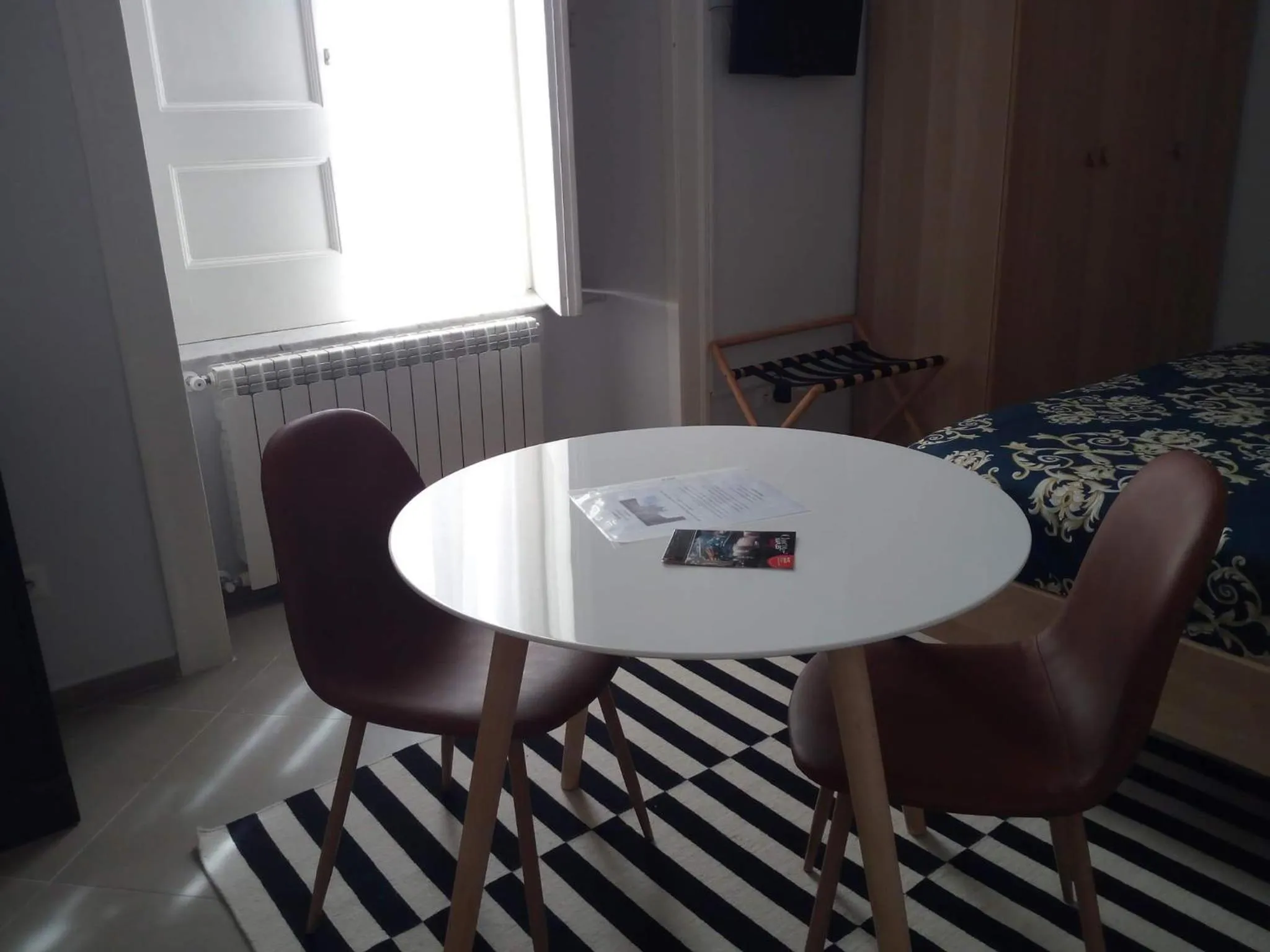 Dining area in Piano Nobile by Napoliapartments