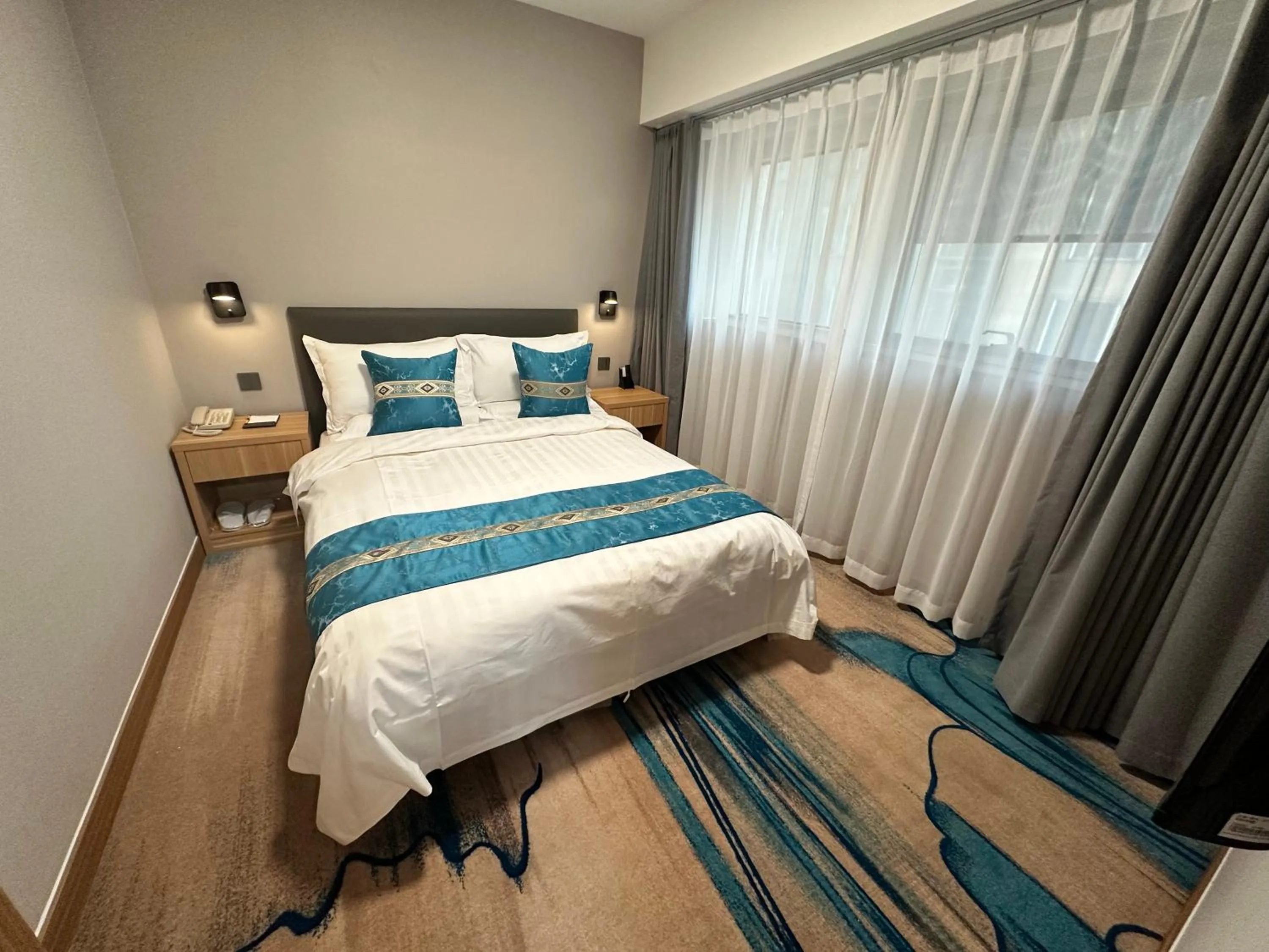 Bed in The North Garden Hotel Beijing Wangfujing