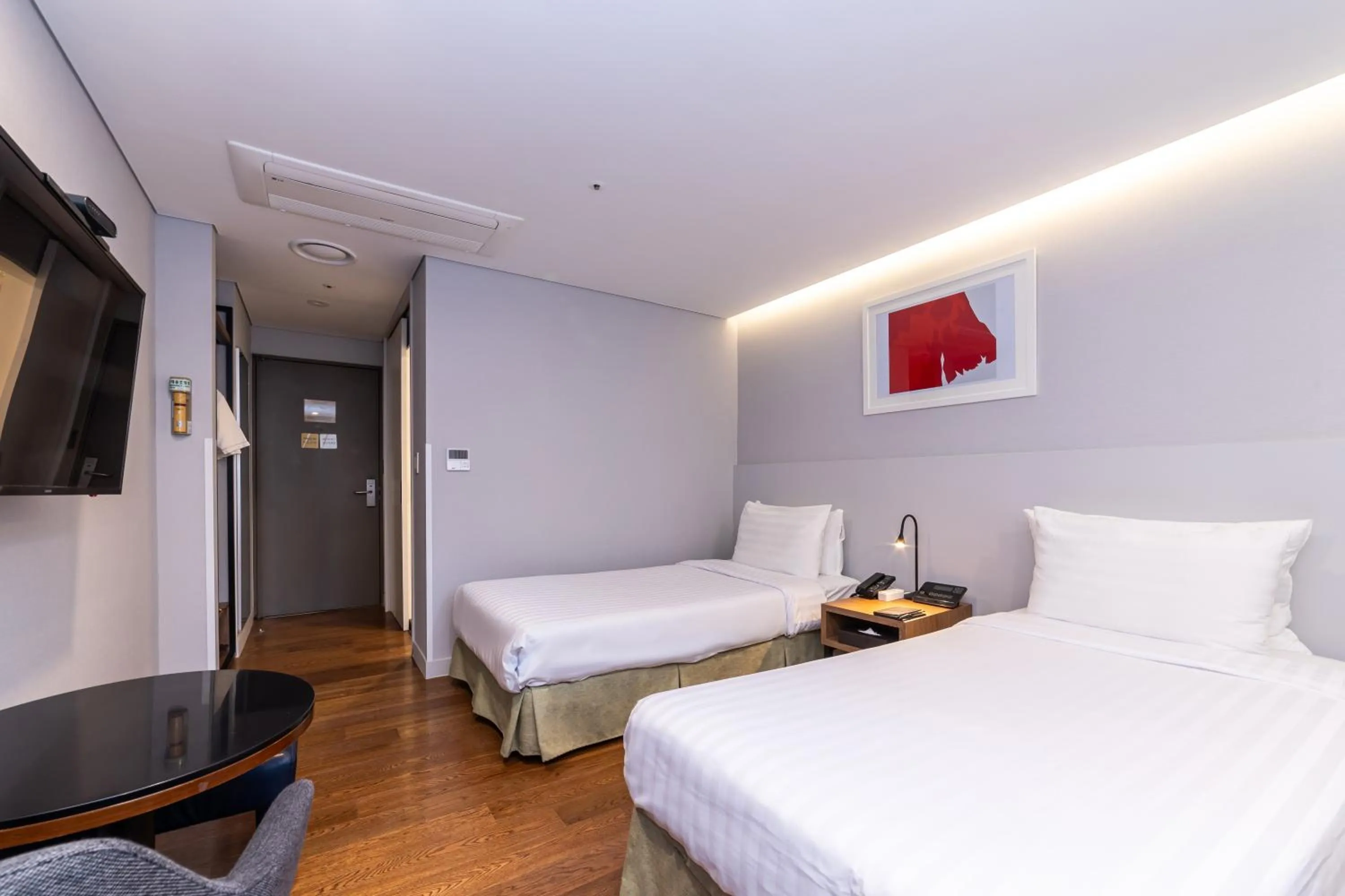 Bed in New Seoul Hotel Myeongdong