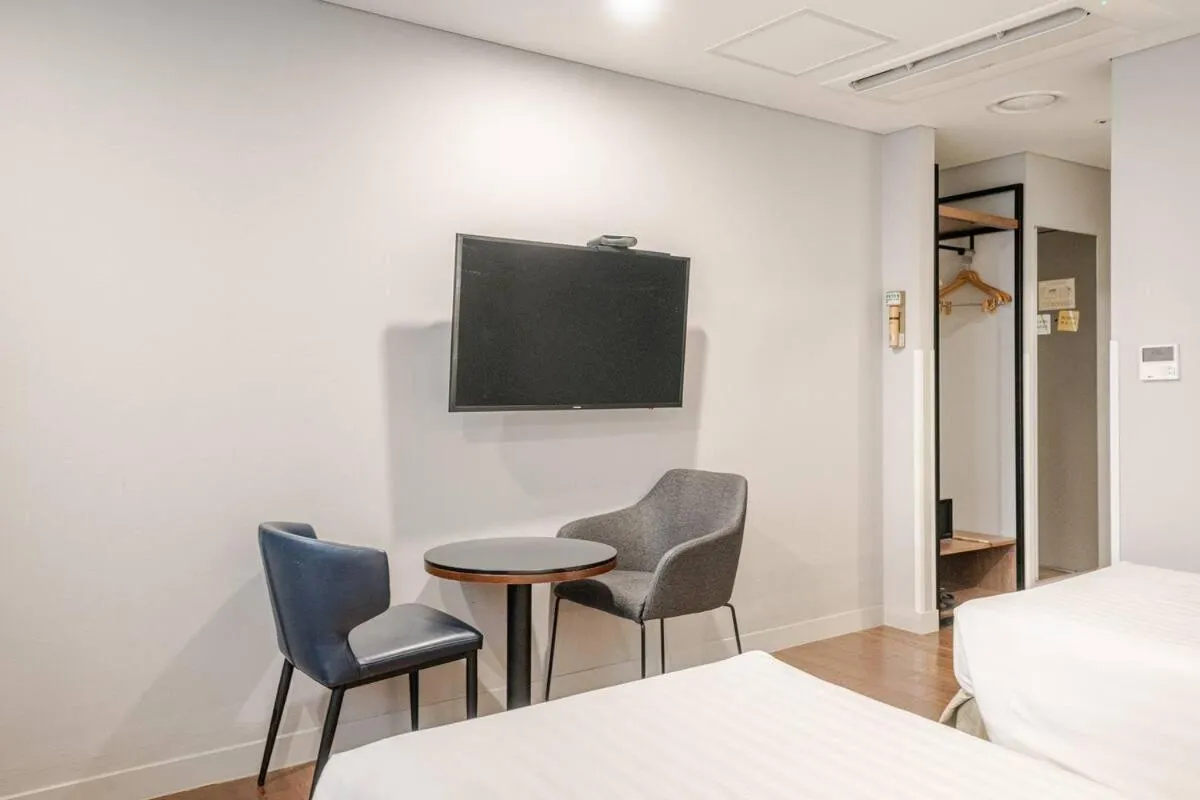 Bed in New Seoul Hotel Myeongdong