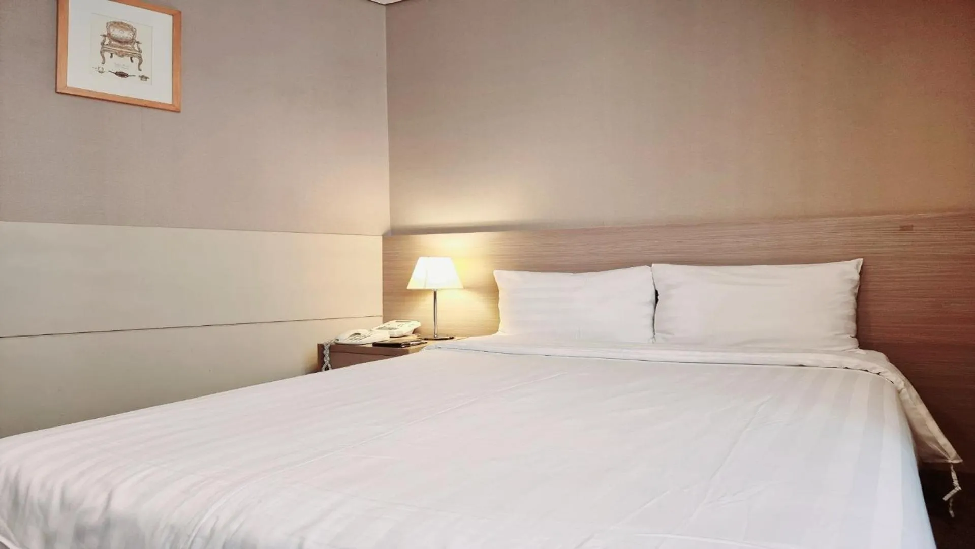 Bed in New Seoul Hotel Myeongdong