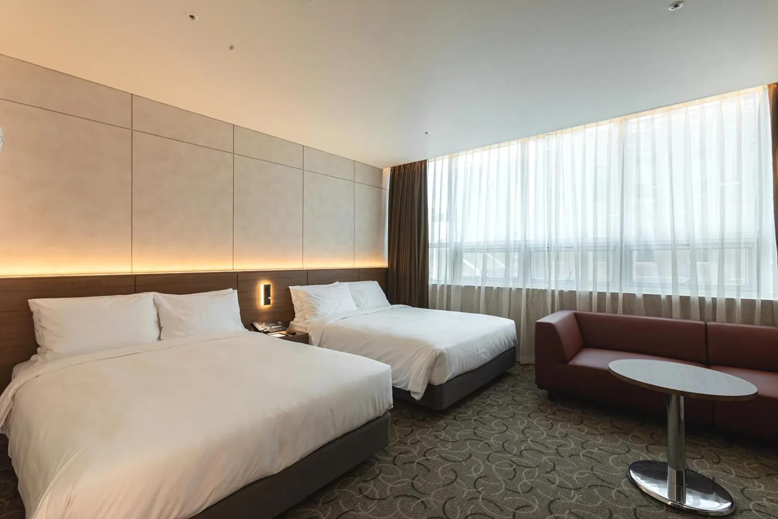 Bed in New Seoul Hotel Myeongdong