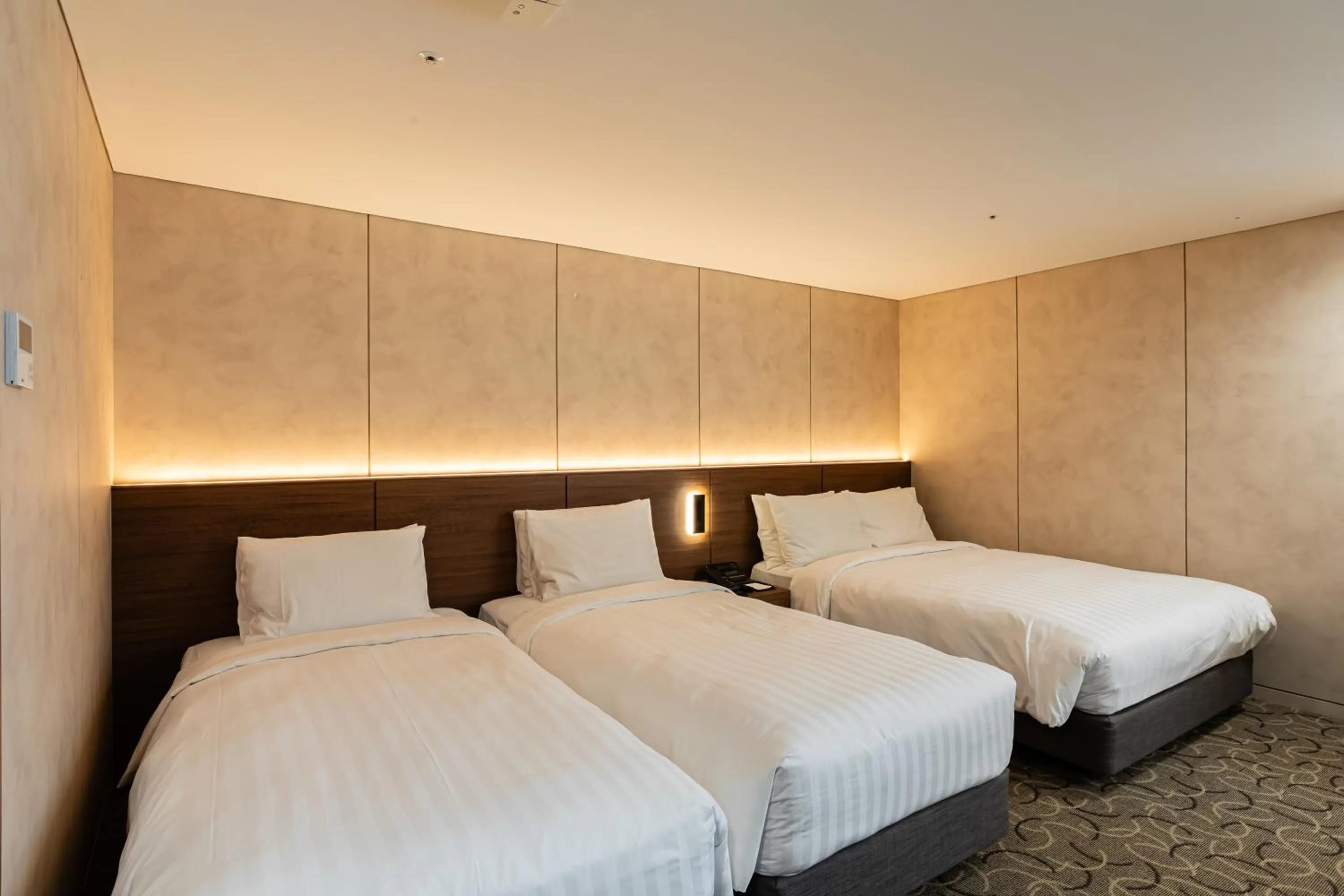 Bed in New Seoul Hotel Myeongdong