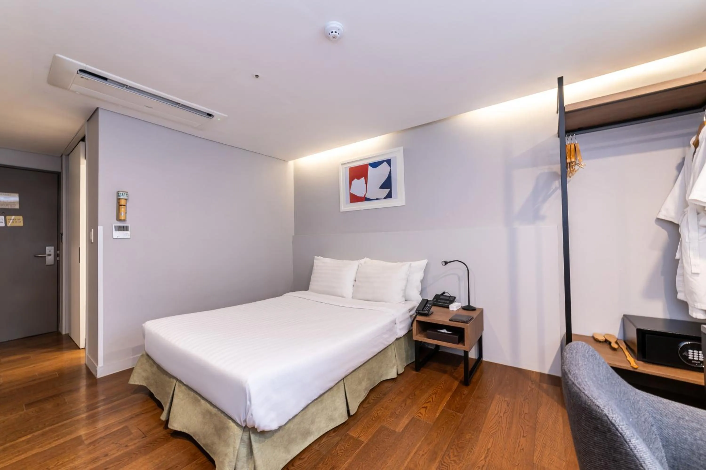 Bed in New Seoul Hotel Myeongdong