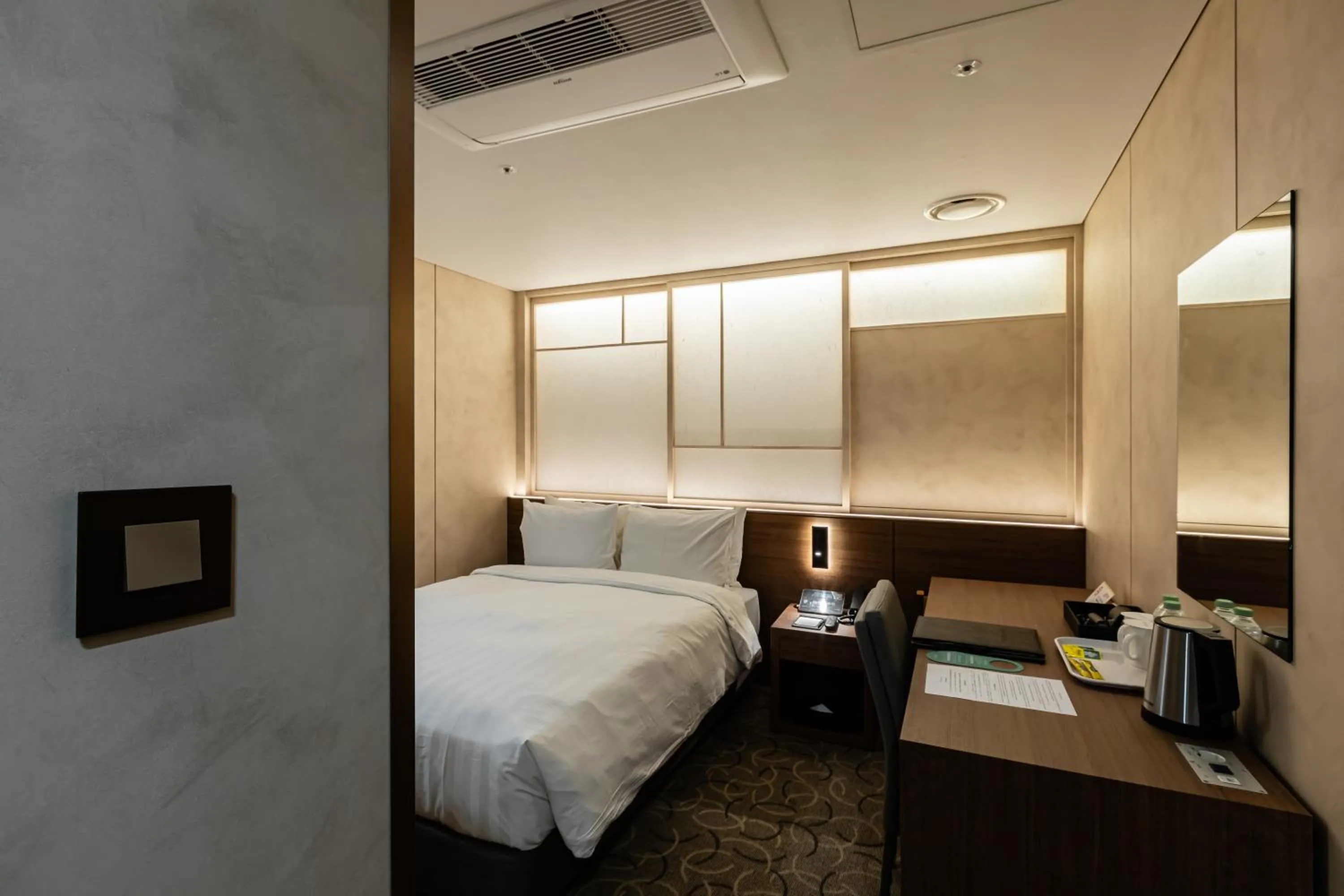 Bed in New Seoul Hotel Myeongdong