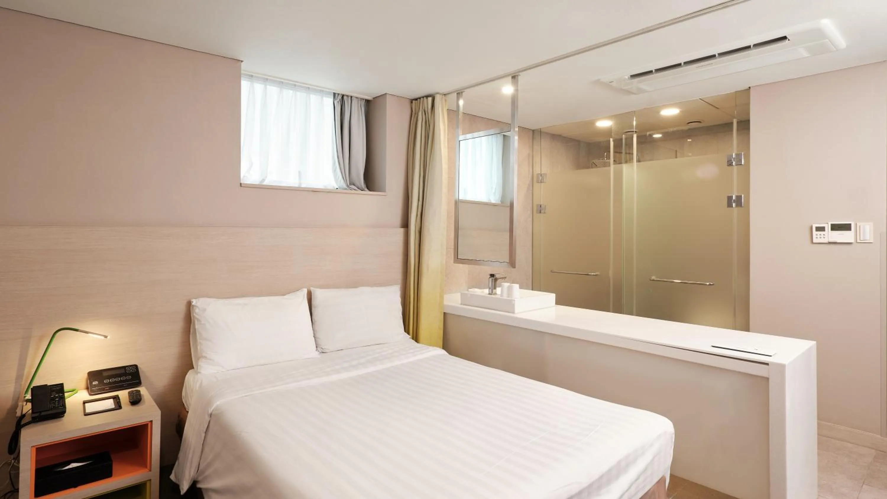 Bed in New Seoul Hotel Myeongdong
